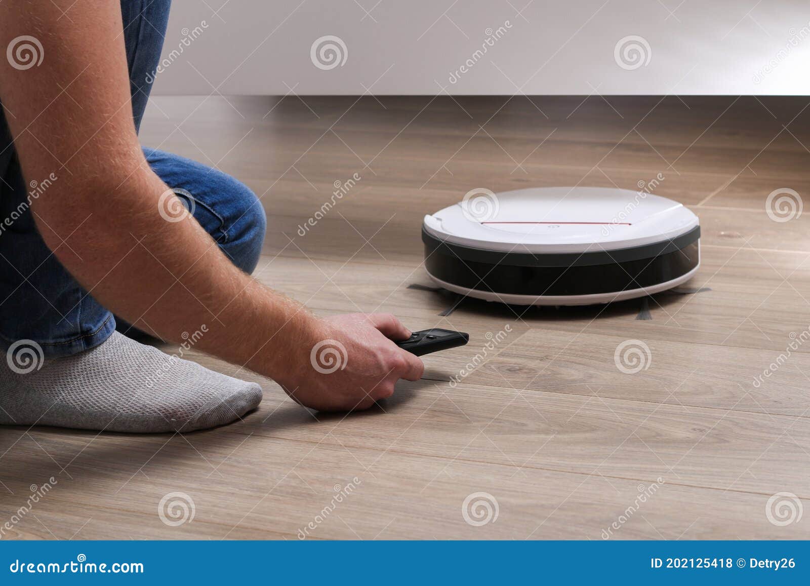 The Robot Vacuum Cleaner Cleans Under Bed Stock Photo Image of clean