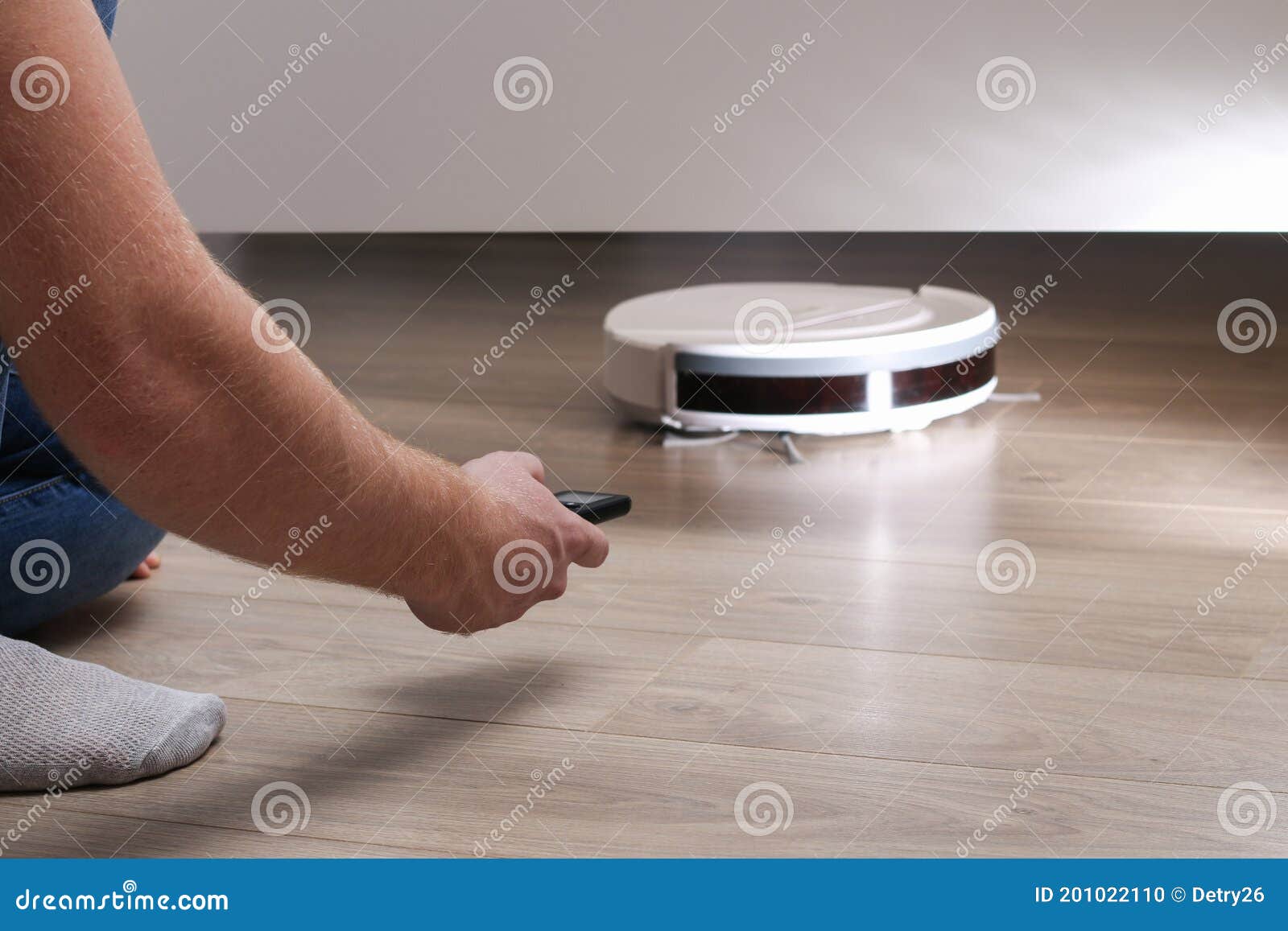 The Robot Vacuum Cleaner Cleans Under the Bed Stock Photo Image of