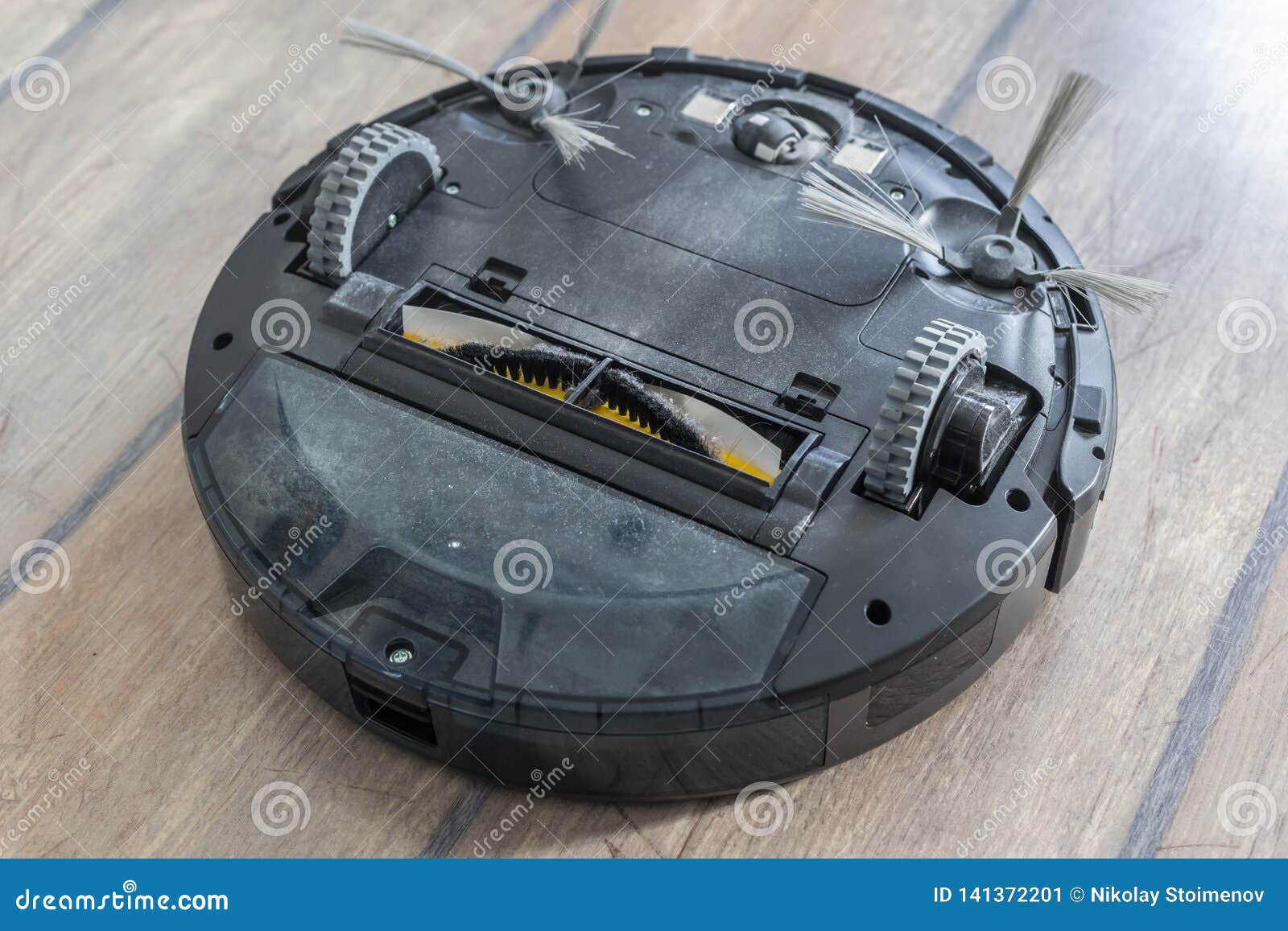 Bottom of a Robot Vacuum Cleaner Wheels and Brushes Stock Image