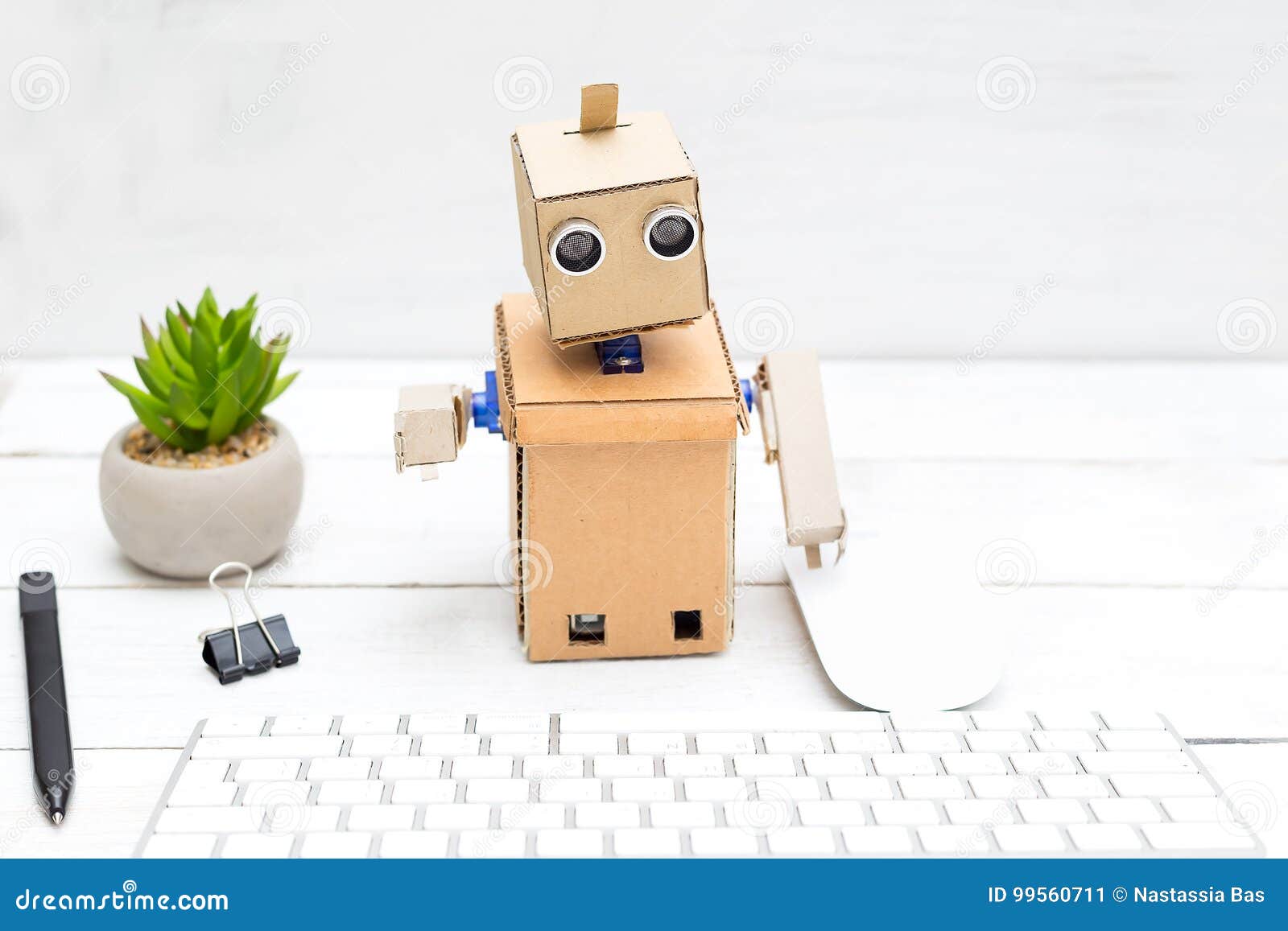 The Robot Works Behind the Computer on the Keyboard Stock Image Image