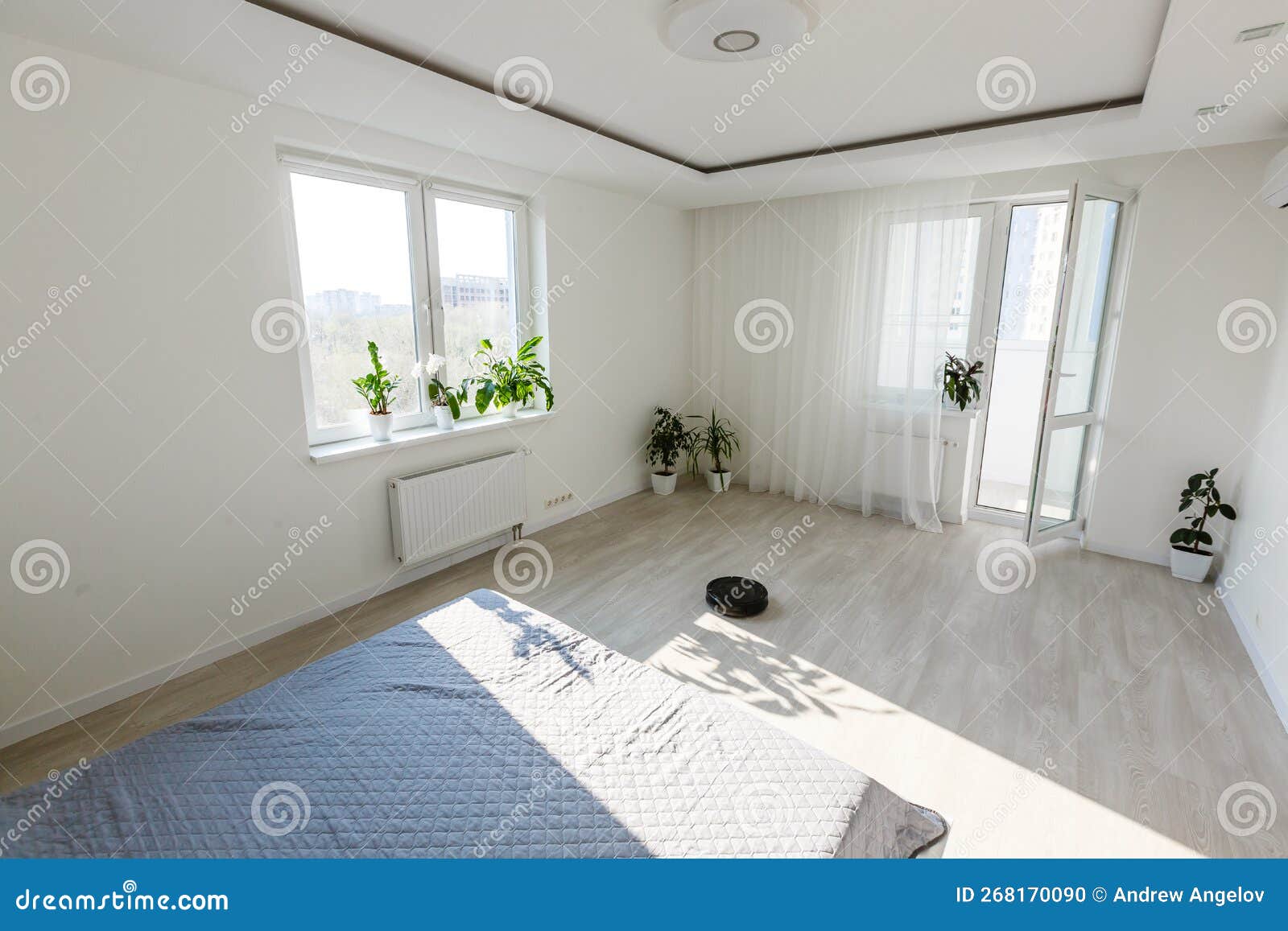 Robotic Vacuum Cleaner Cleaning the Bedroom Stock Photo Image of