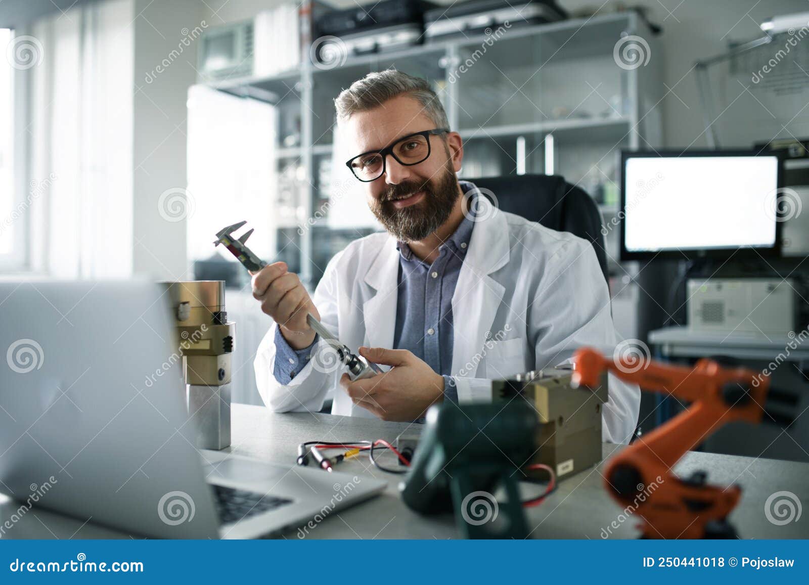 Robotics Engineer Working on Desing of Modern Robotic Arm and Sitting