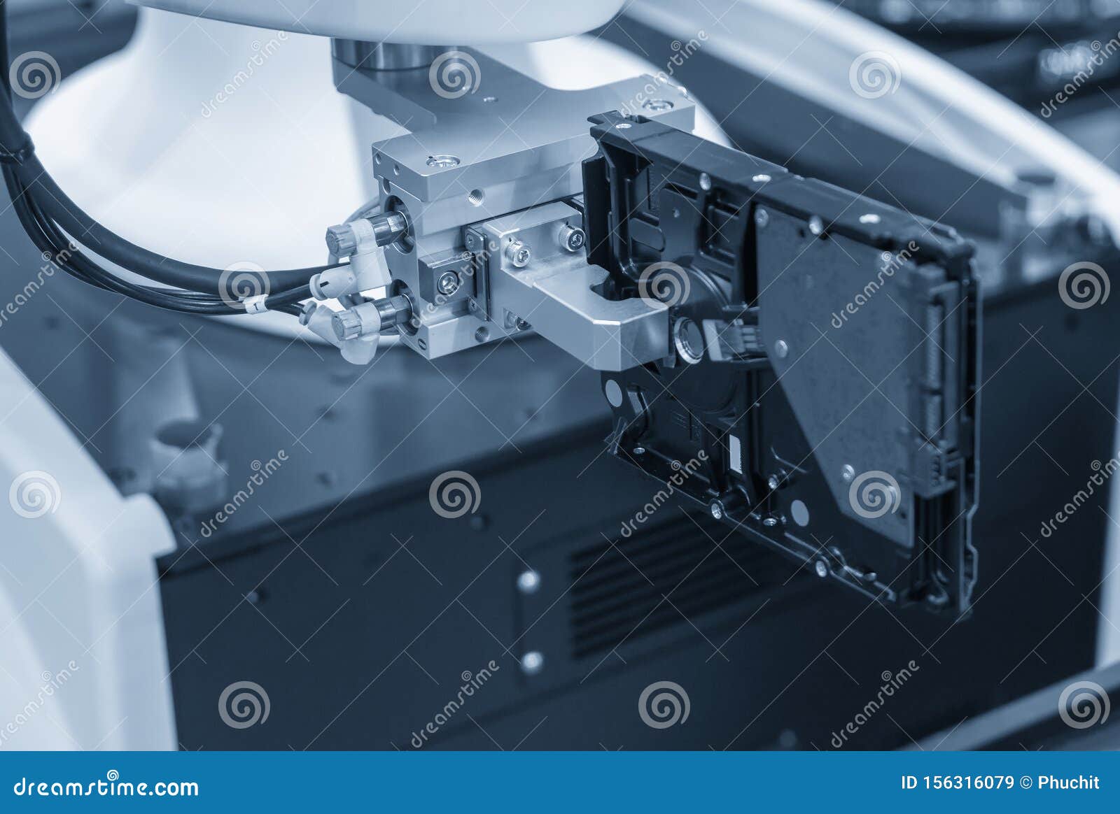 The Robotic Arm Handing The Raw Material For CNC Lathe Machine Stock the-robotic-arm-handing-the-raw-material-for-cnc-lathe-machine-stock
