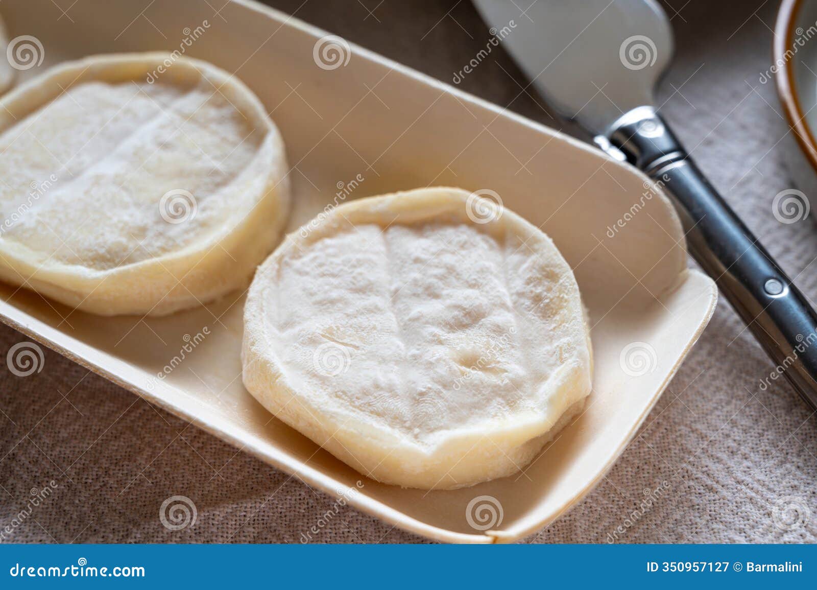 rocamadour or cabecous soft goat aoc cheese with soft rind produced on farm in perigord and quercy on farmers market, departement