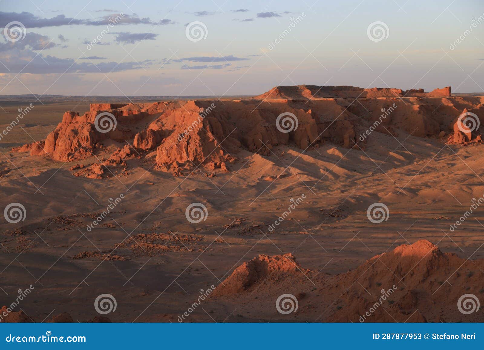 the rock formations of bayanzag flaming cliff at sunset, mongolia