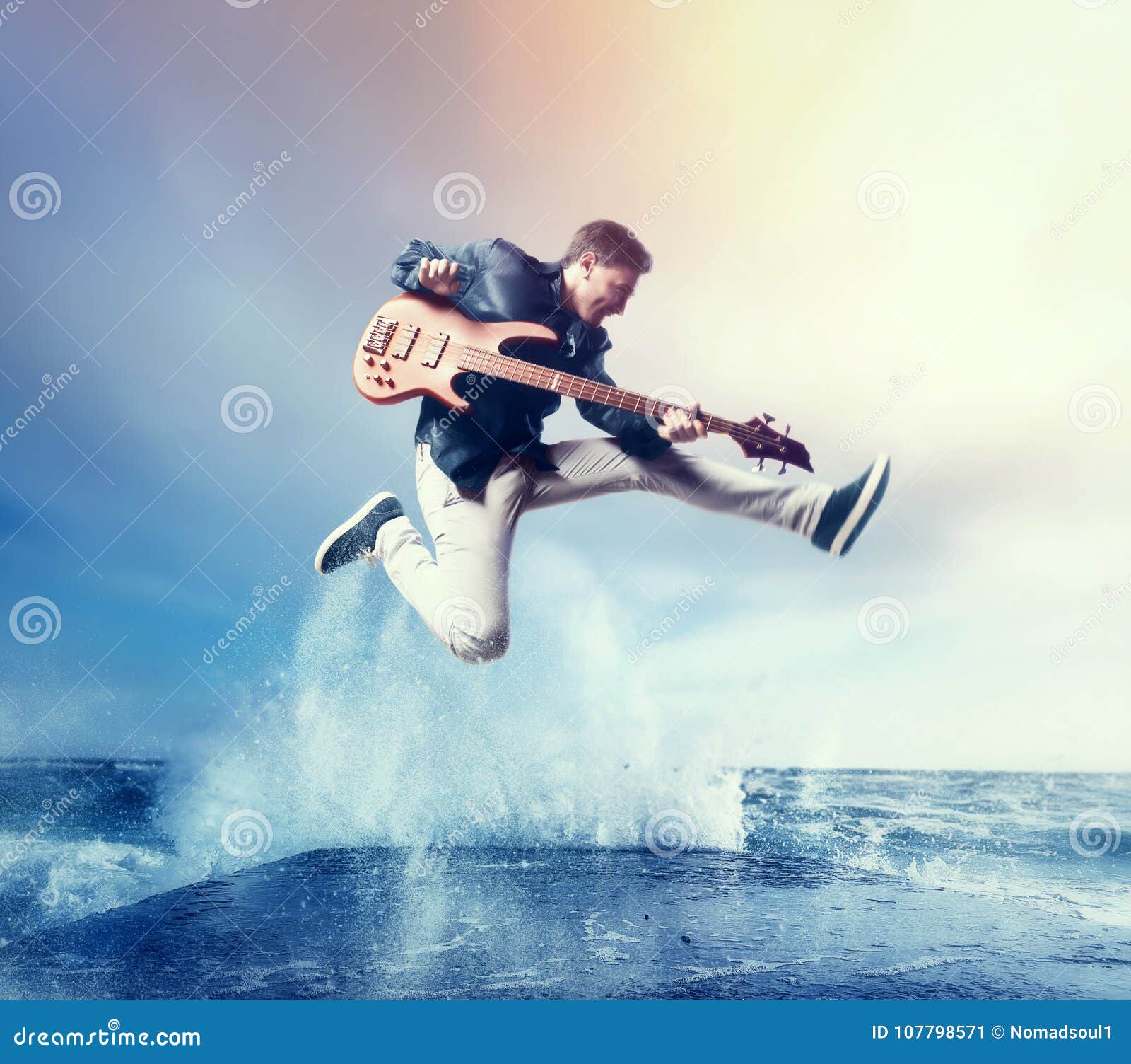 rock guitarist with bas-guitar, snapshot in a jump