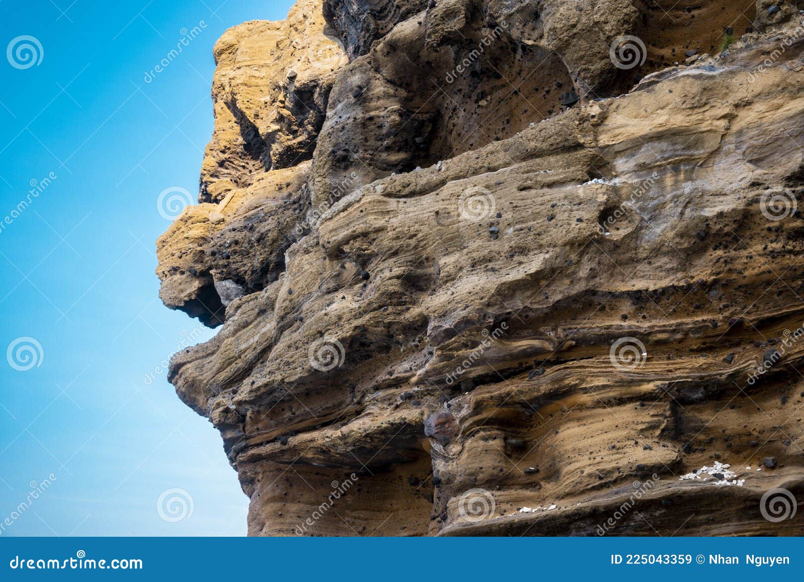 a rock with many holes eroded by the sea waves