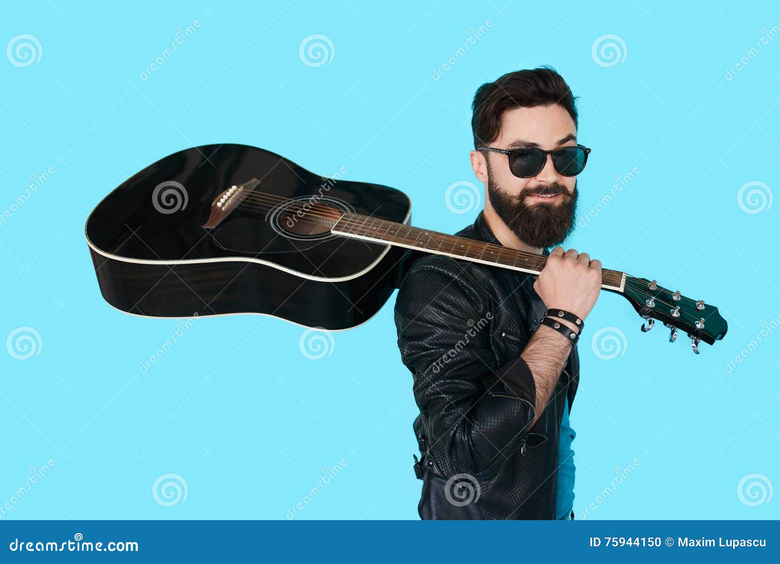 rock musician posing with guitar