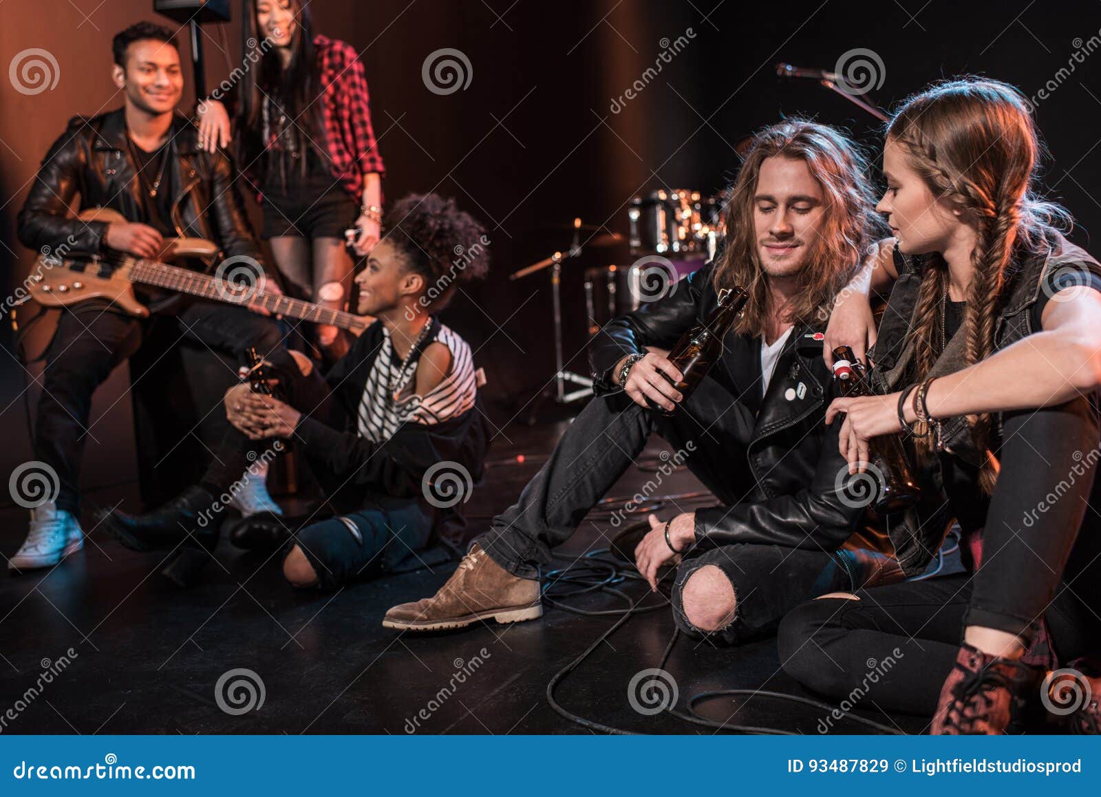 Rock and Roll Band Drinking Beer after Concert on Stage Stock Image