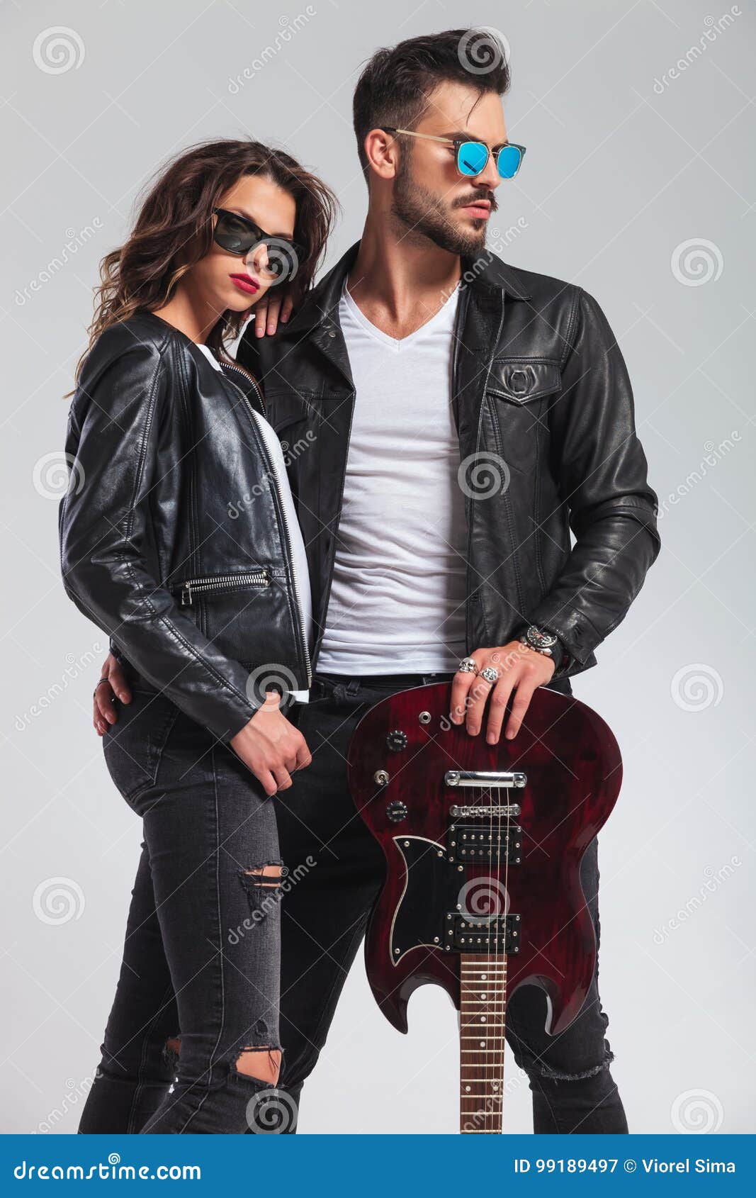 Rock and Roll Couple Standing Embraced Stock Image - Image of handsome,  cute: 99189497