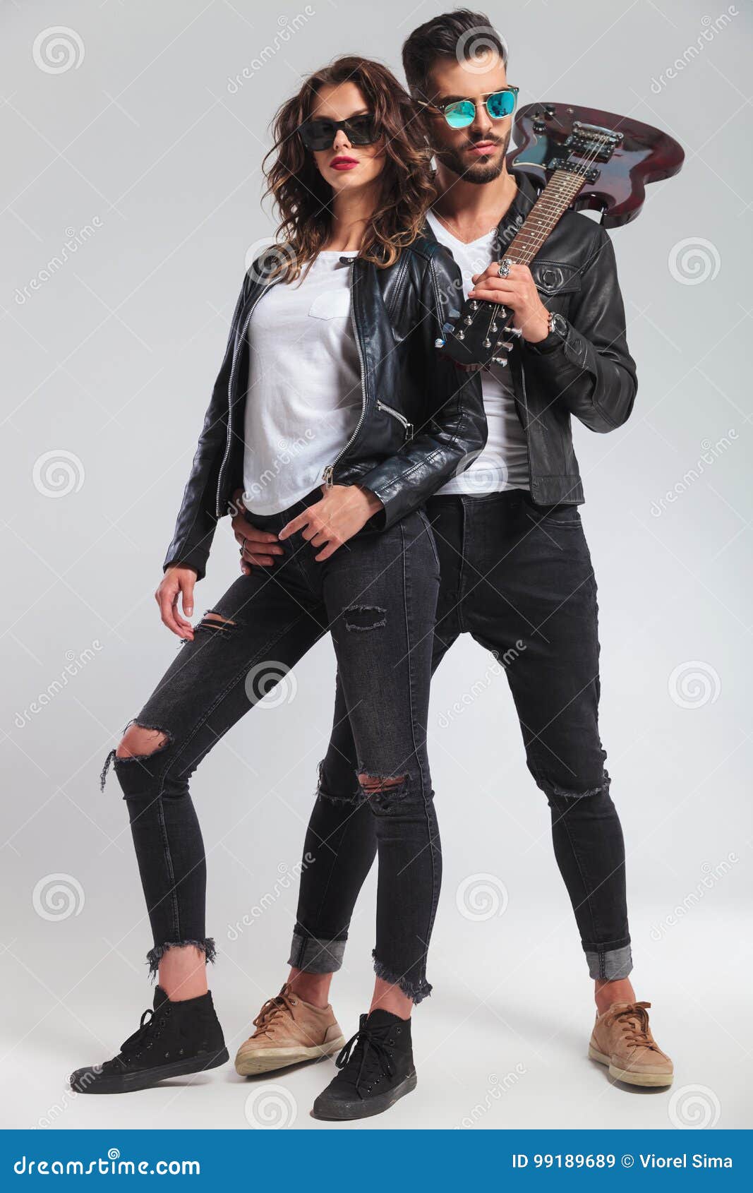 Rock and Roll Man with Guitar on Shoulder Embracing Woman Stock Image -  Image of leather, hold: 99189689