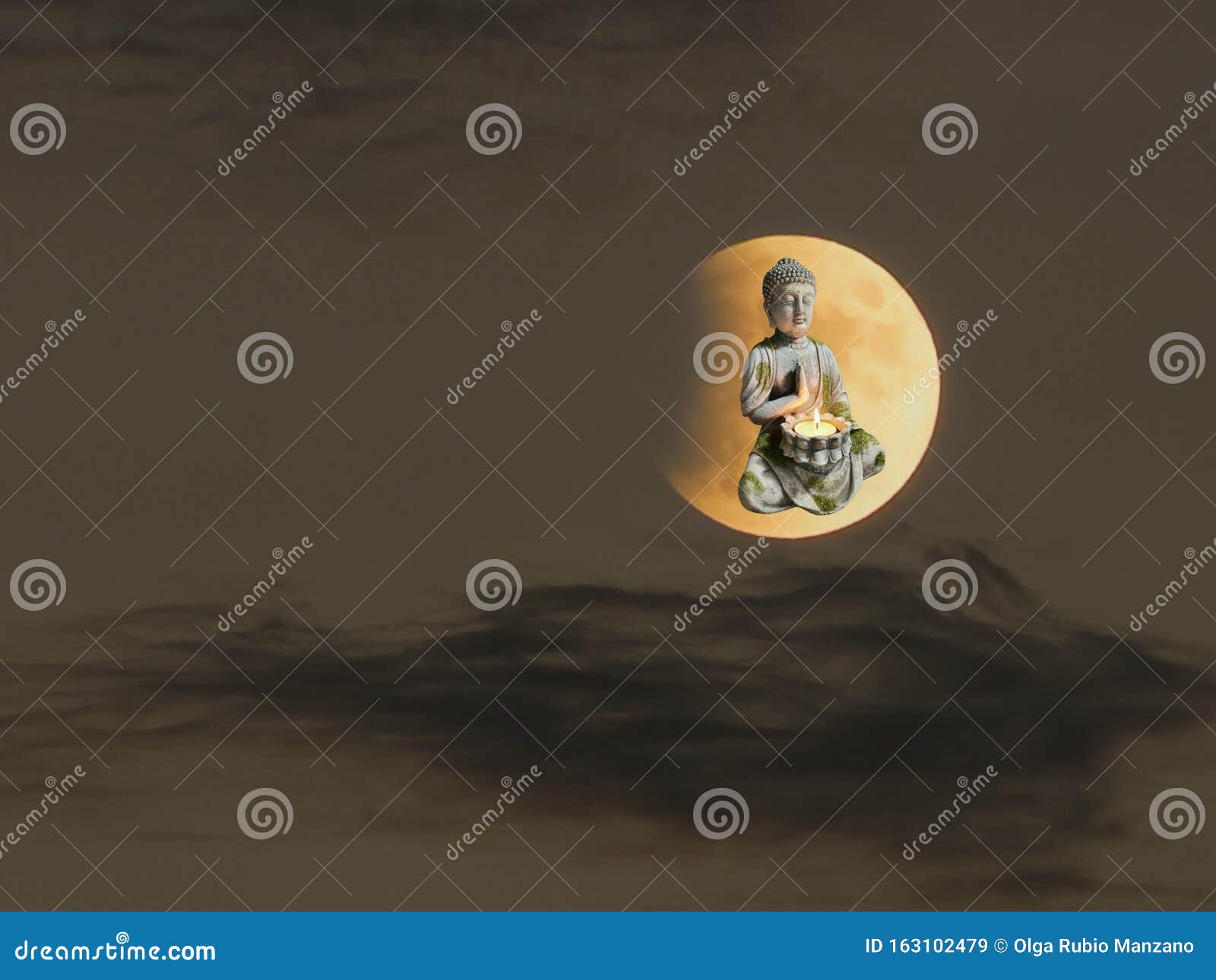 rocked statue of budha  in bokeh background