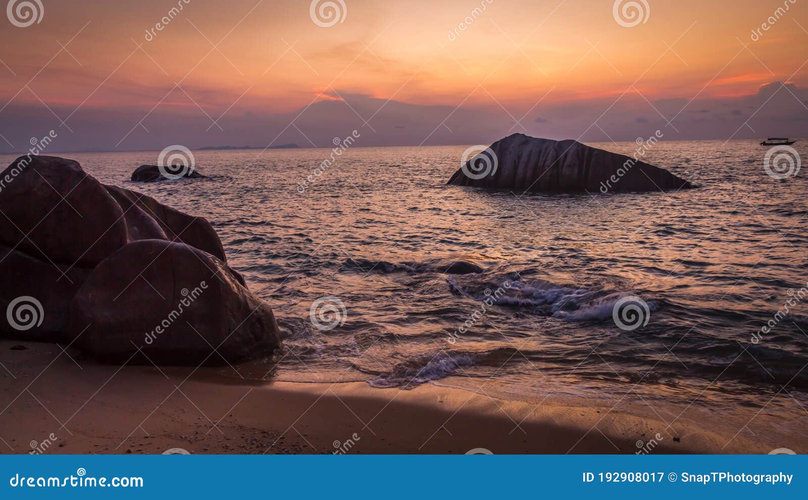 rocks on melina beach at sunset, tiomen island, malaysia