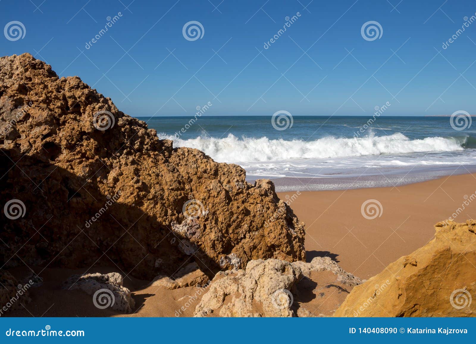 rocks sandy beach lalla fatna morocco clean dark yellow sand foamy waves atlantic ocean horizon background clear 140408090