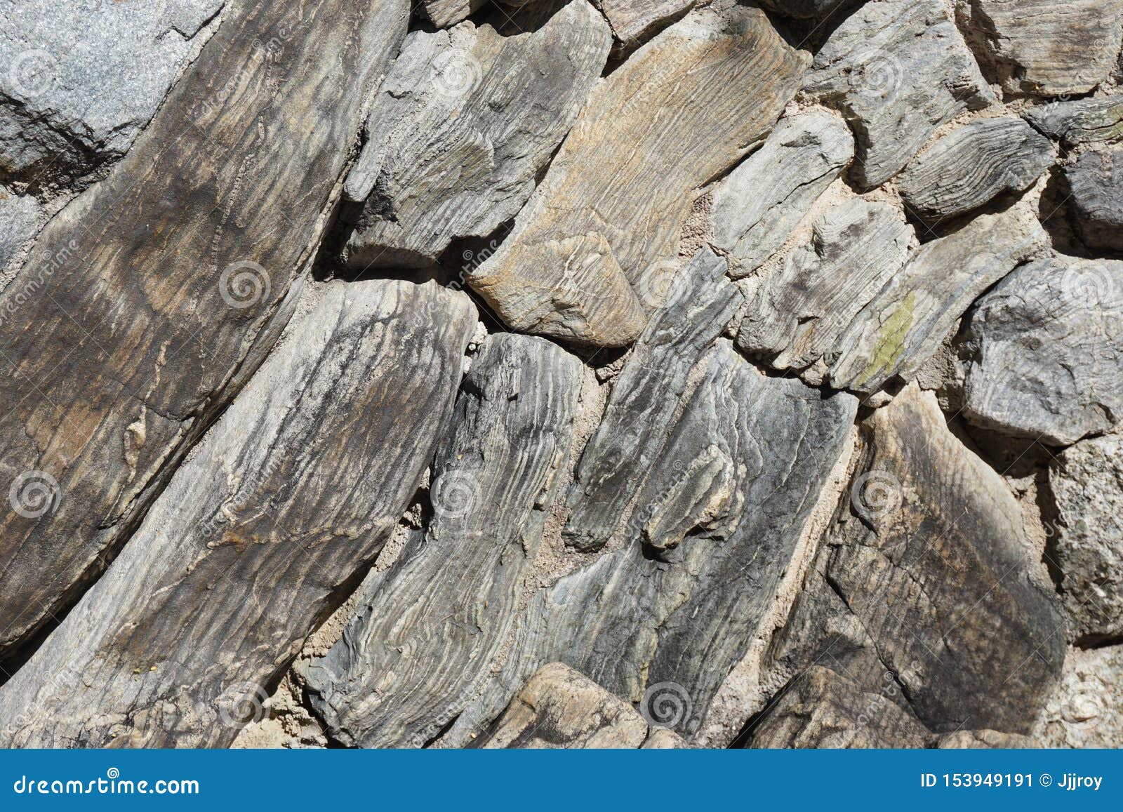 Rocks With Unusual Striation Patterns Form A Natural Wall Stock Image