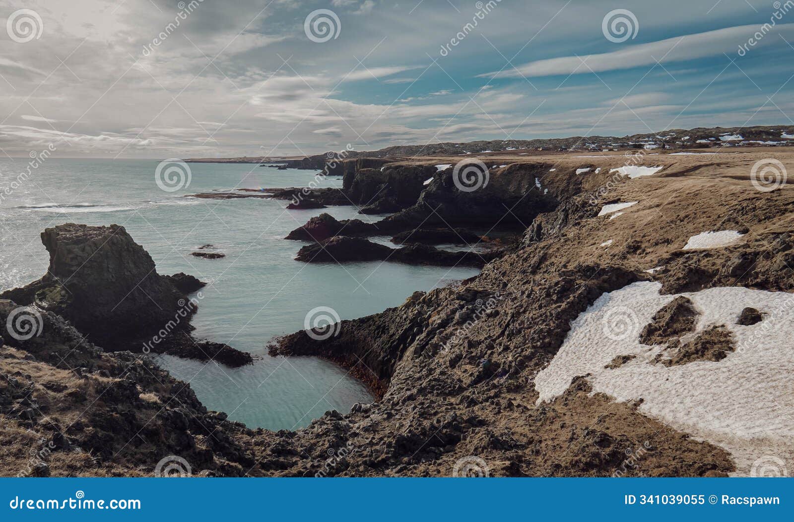 rocky coast of arnarstapi washed by the atlantic