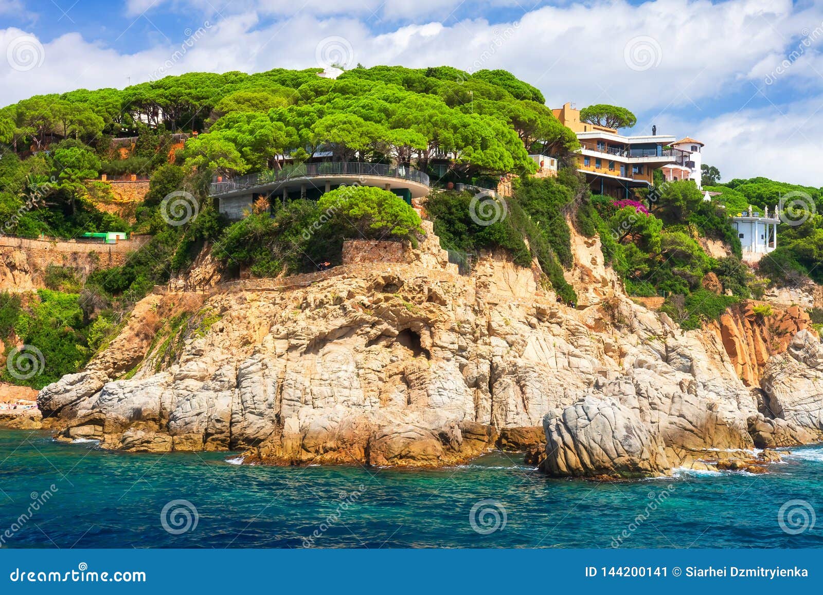 rocky coast landscape in mediterranean with modern beautiful house on high sea shore in costa brava, spain