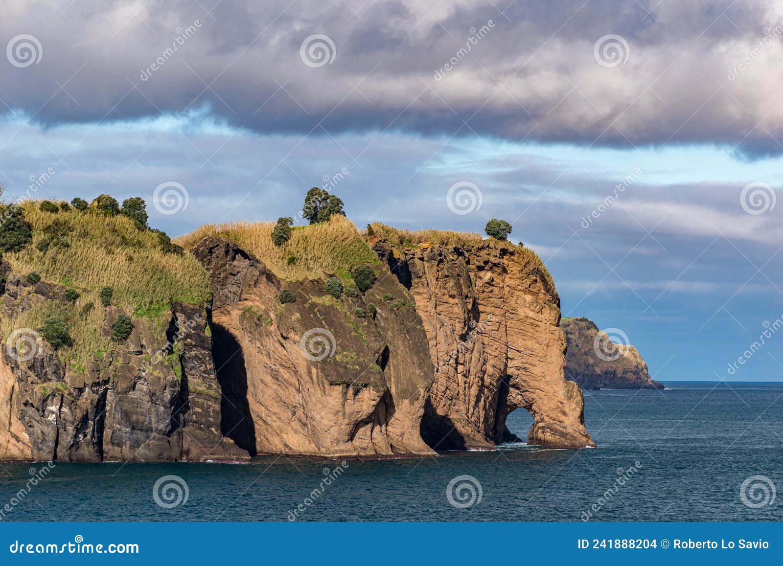 rocky coastline in sao miguel island with characteristic rock formation called tromba do elefante azores, portugal