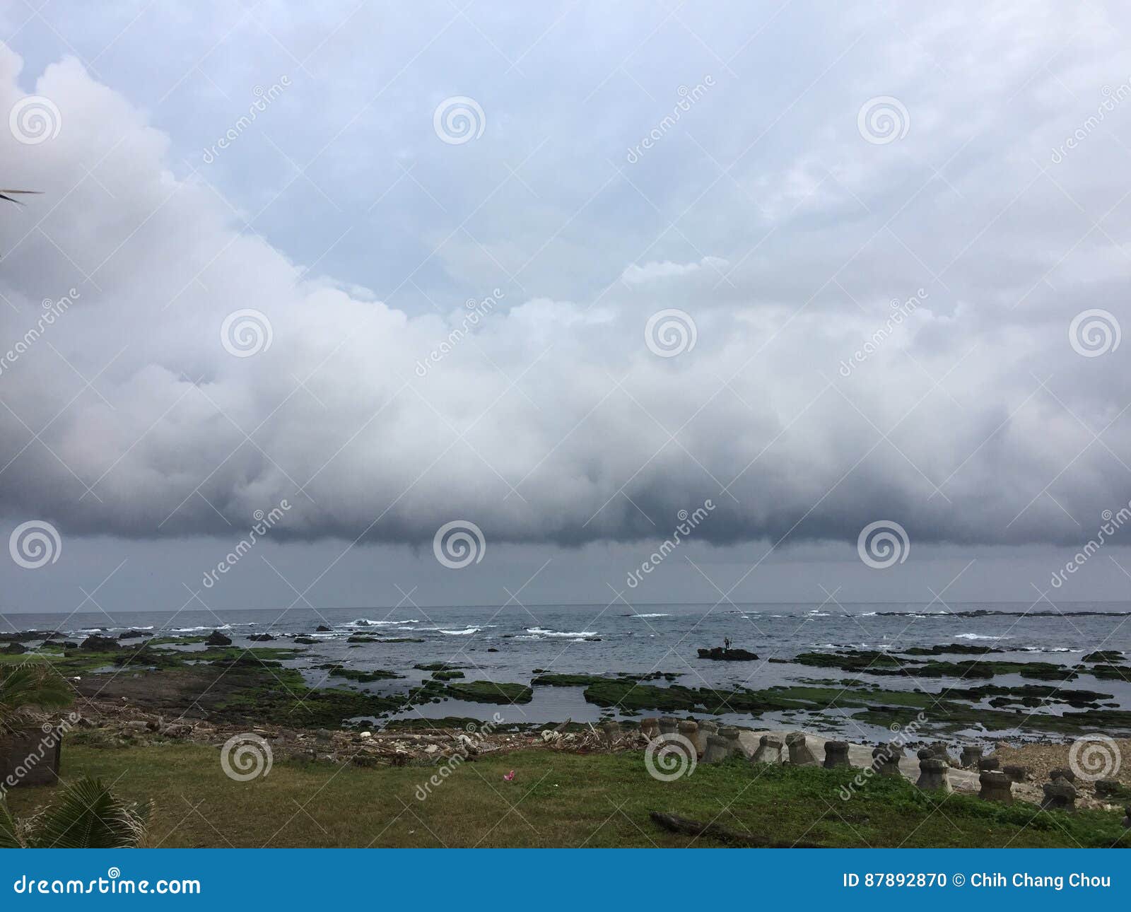 rocky foreshore and low cloud over the sea