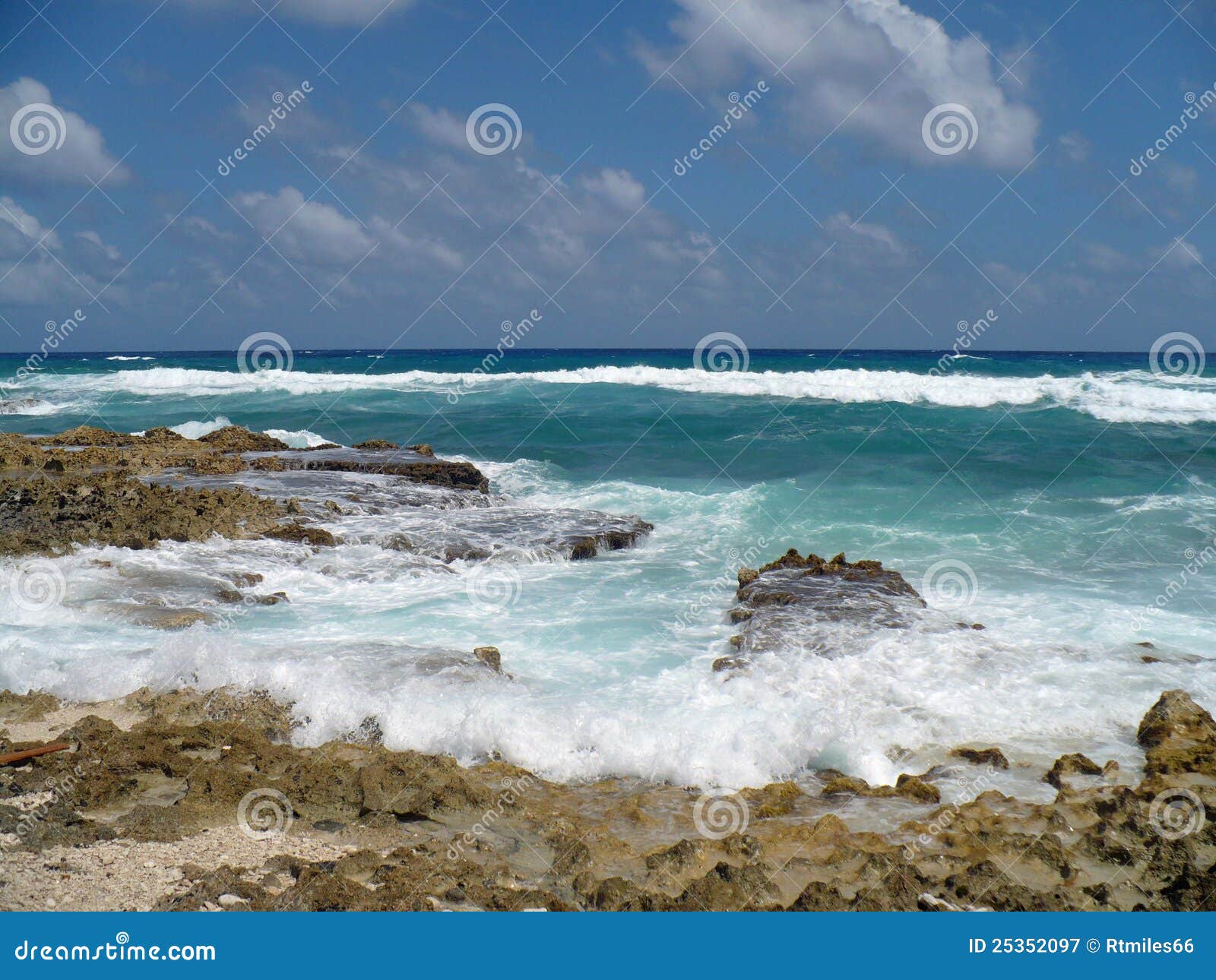 Rocky Ocean Beach in Cozumel Mexico. Breaking waves of ocean hitting rocks in Cozumel Mexico
