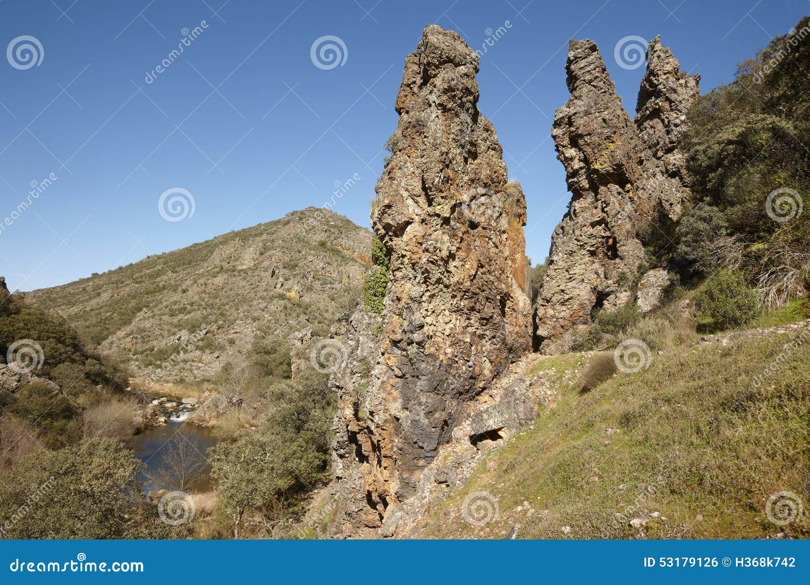 rocky pinnacles and stream in boqueron route. cabaneros, spain