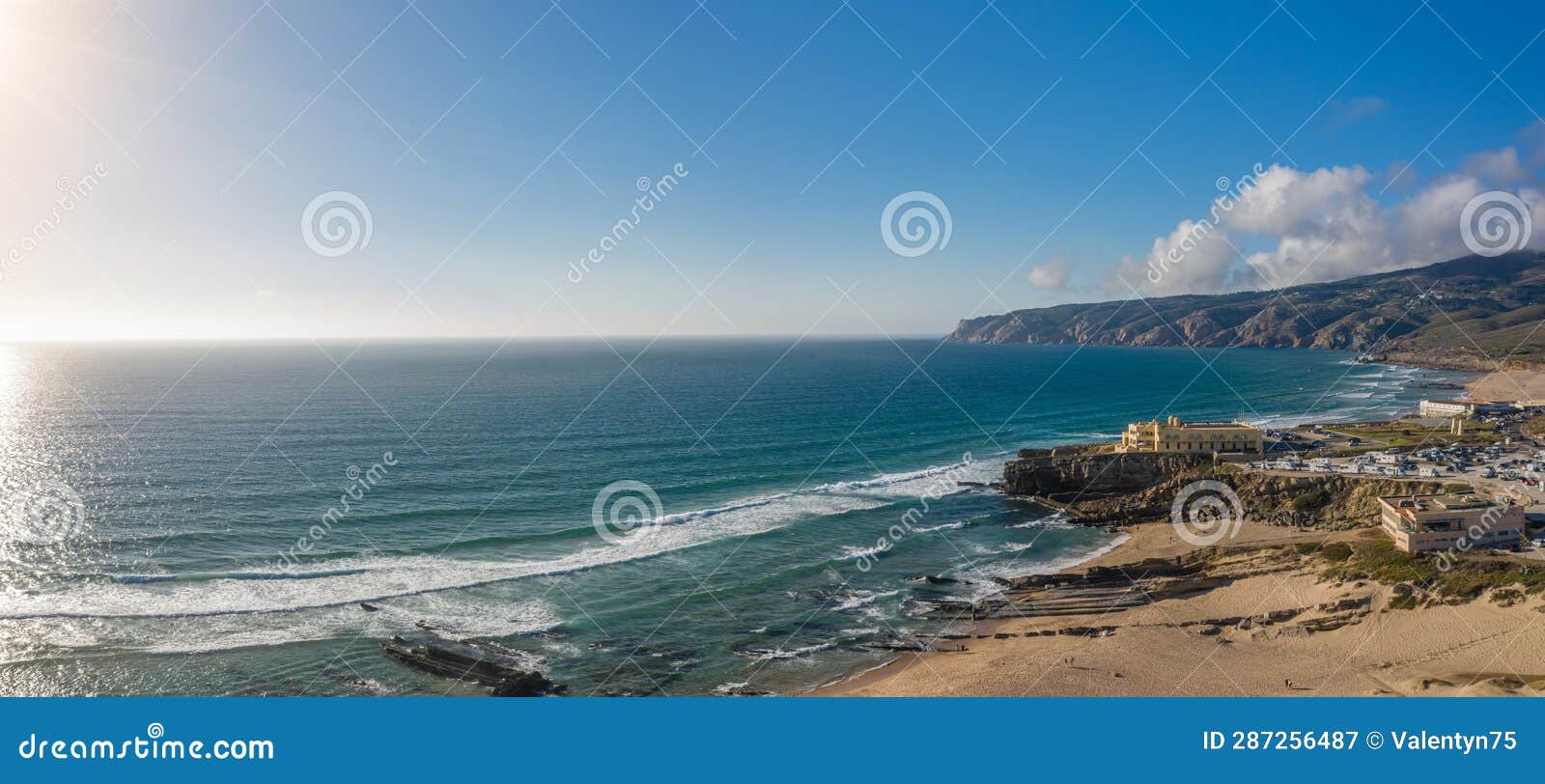rocky and sandy coastlines of portugal ocean coast. aerial view of guincho beach
