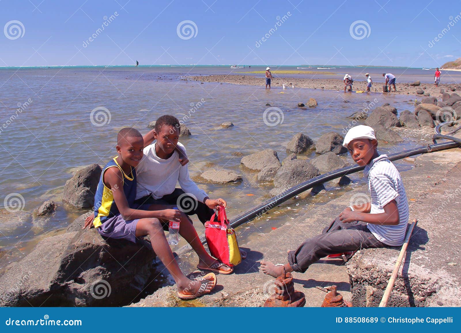 RODRIGUES ISLAND, MAURITIUS - NOVEMBER 13, 2012: Octopus Fishing with Three  Local Boys Posing Editorial Stock Image - Image of octopus, tropical:  88508689