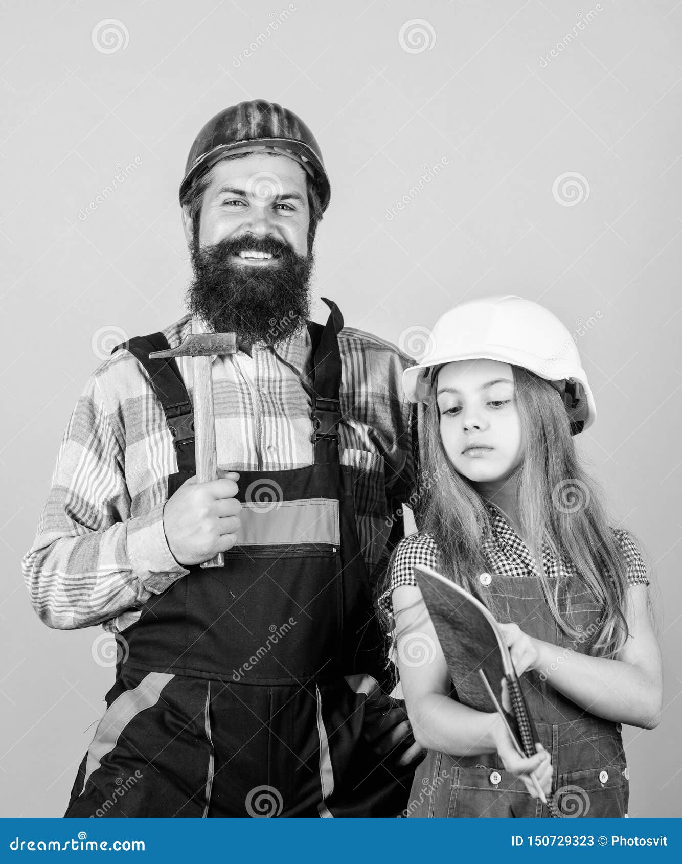 Family remodeling house. Home remodel and renovation. Child renovation room. Father and daughter hard hat helmet uniform renovating home. Home improvement activity. Kid girl planning renovation.