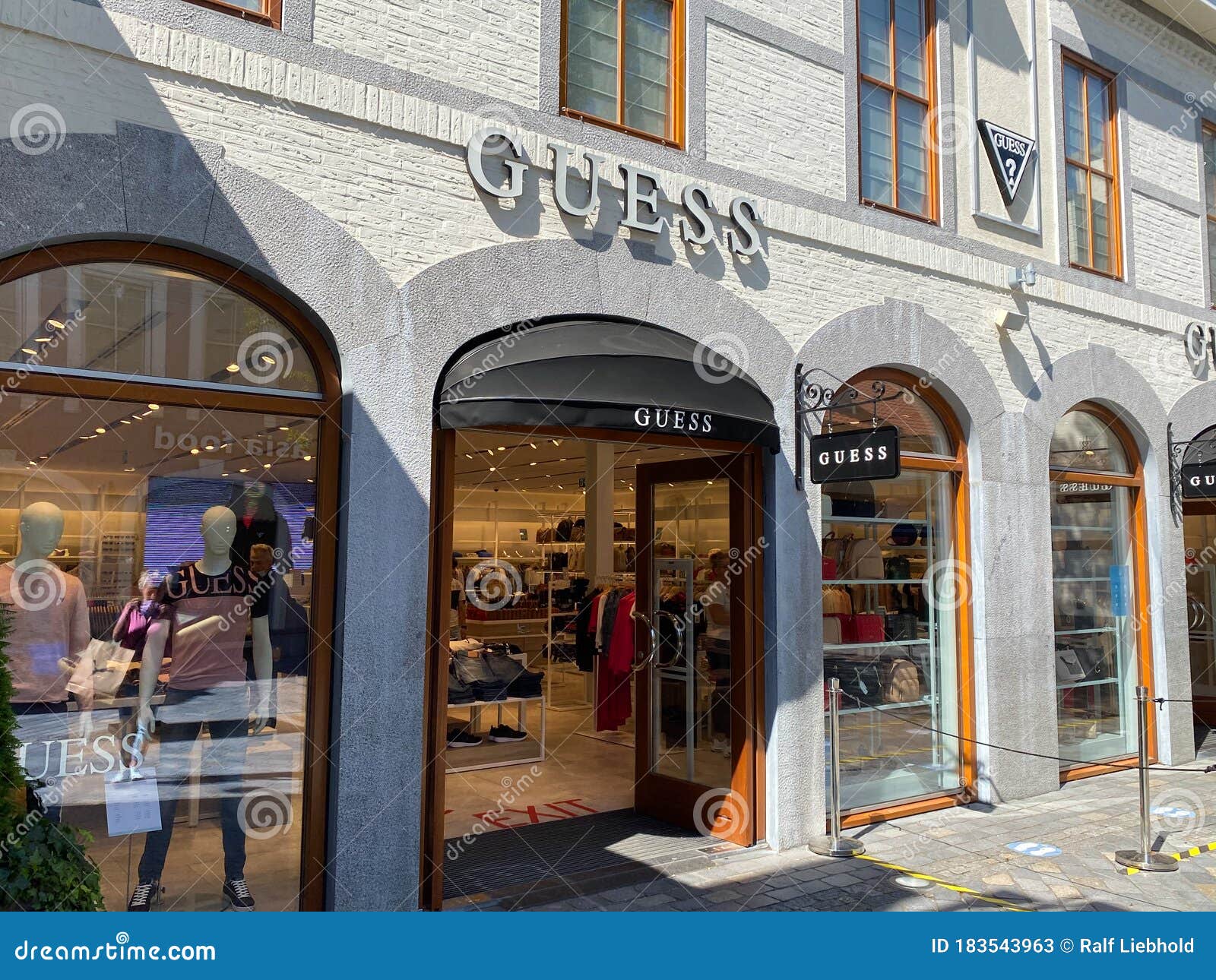 View on Facade Logo of Guess Fashion Company at Shop Editorial Photo - Image of company, sign: 183543963