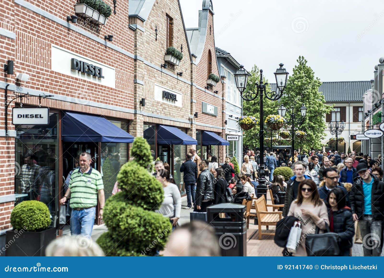 Roermond, Netherlands 07.05.2017 People Walking Around At The Mc Arthur Glen Designer Outlet ...