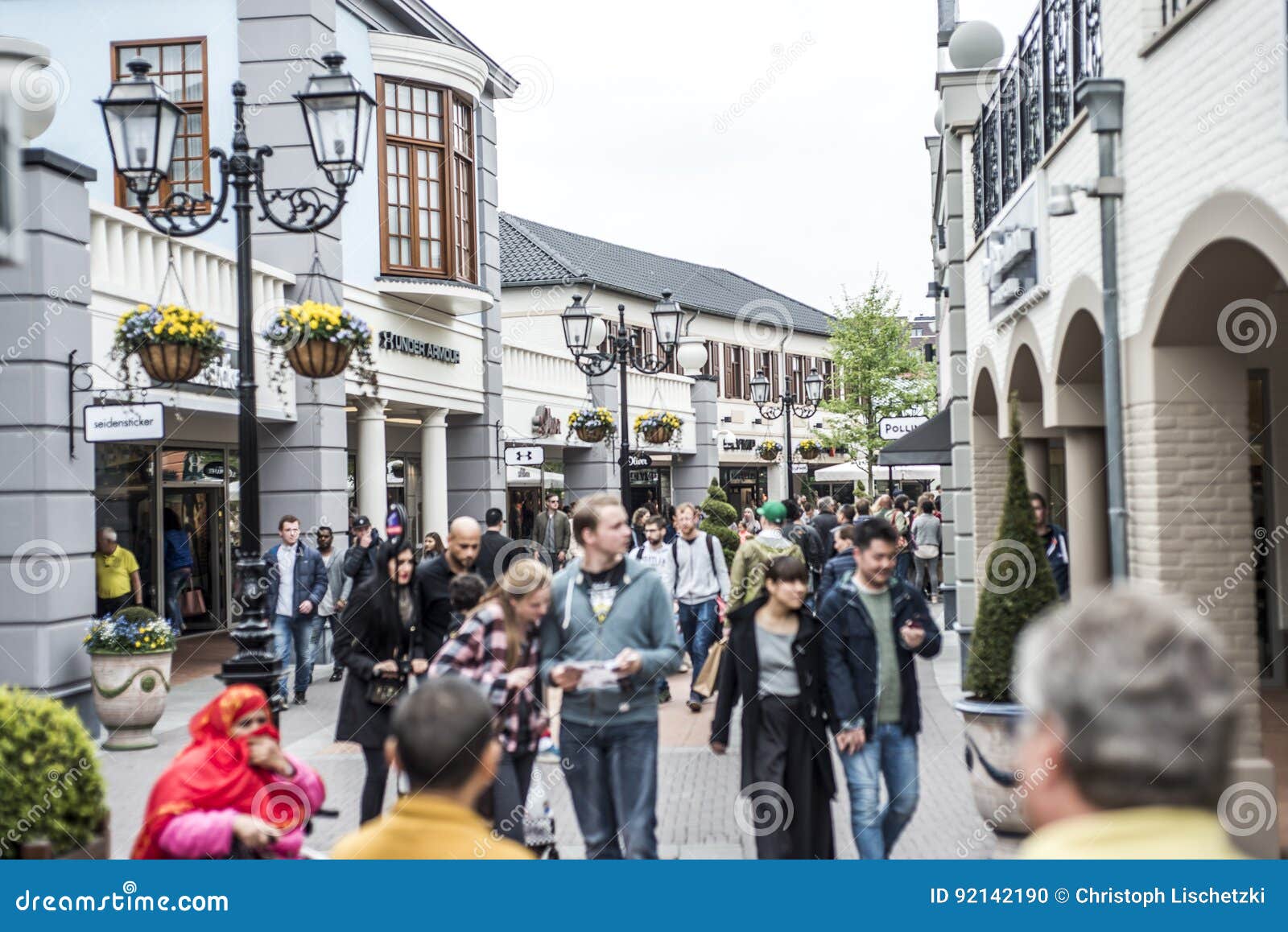 Roermond, Netherlands 07.05.2017 People Walking Around At The Mc Arthur Glen Designer Outlet ...