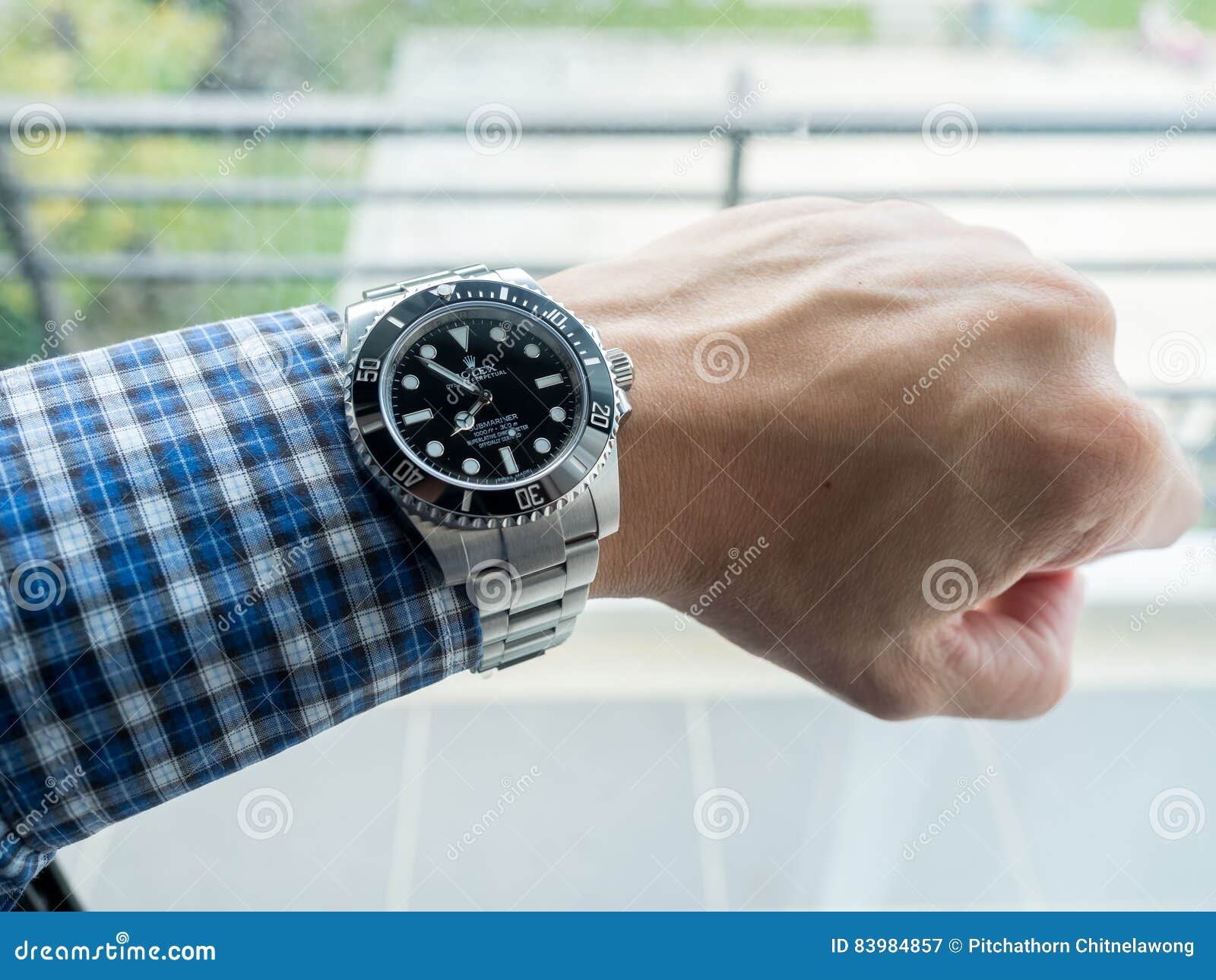 wearing a rolex submariner