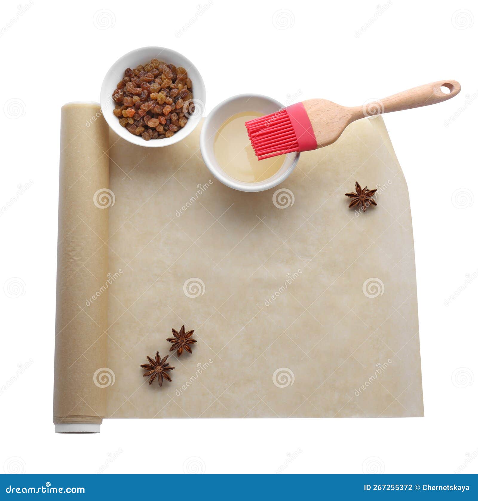 Roll of Baking Parchment Paper and Different Ingredients Isolated on