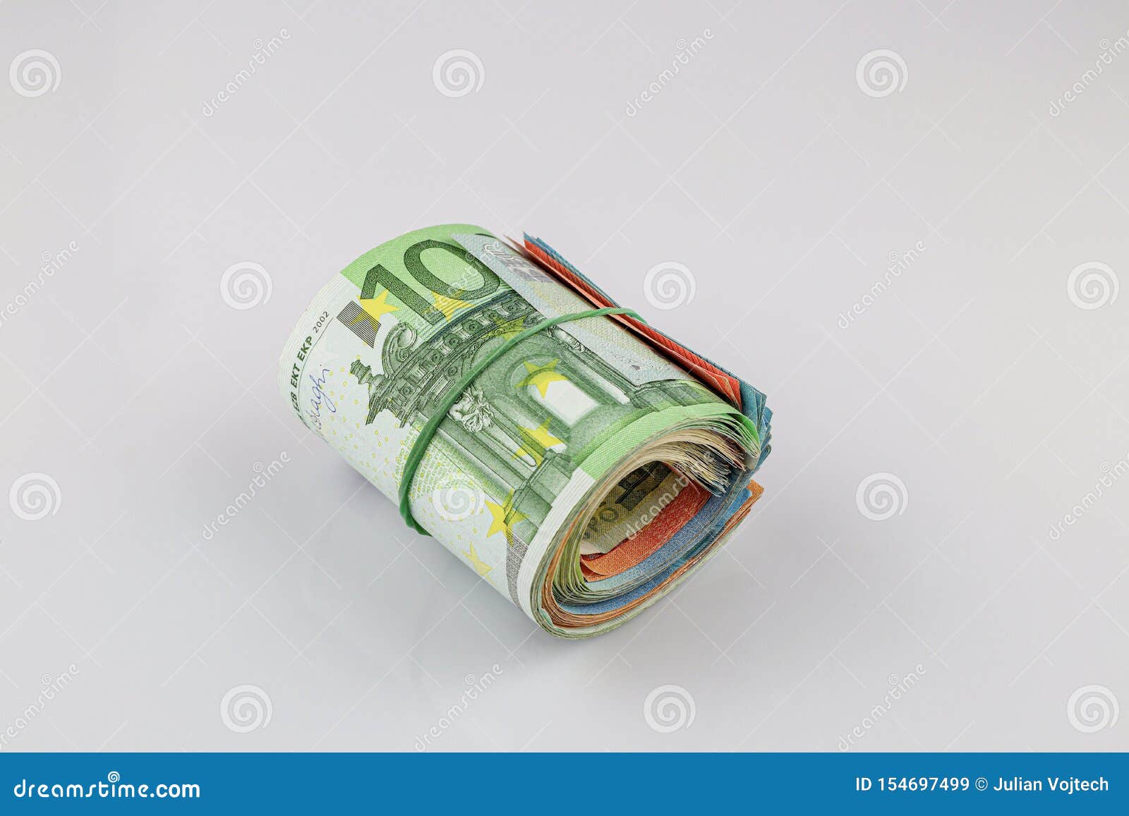 Roll Of 100, 50, 20 And 10 Euro Banknotes With A Rubber Band, Isolated