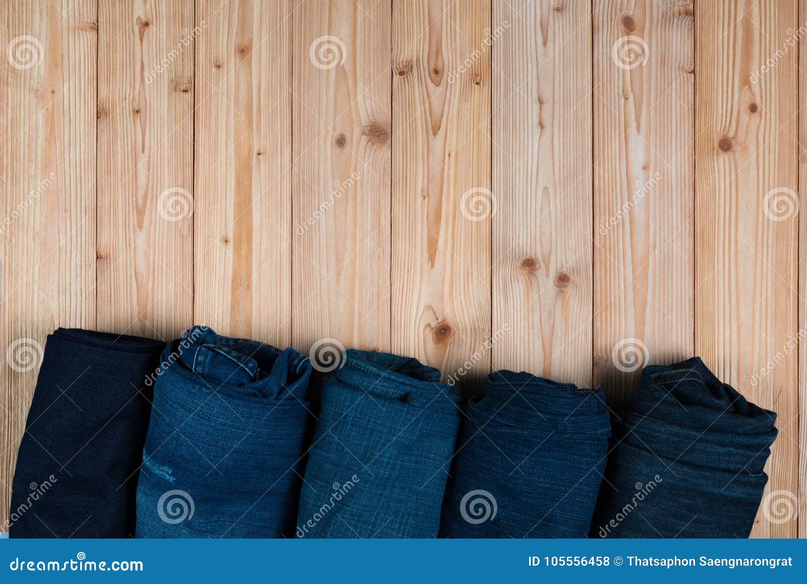 Roll Frayed Jeans or Blue Jeans Denim Collection on Rough Wooden Stock ...