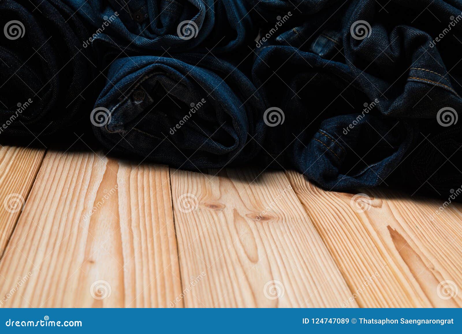 Roll Frayed Jeans or Blue Jeans Denim Collection on Rough Wooden Stock ...