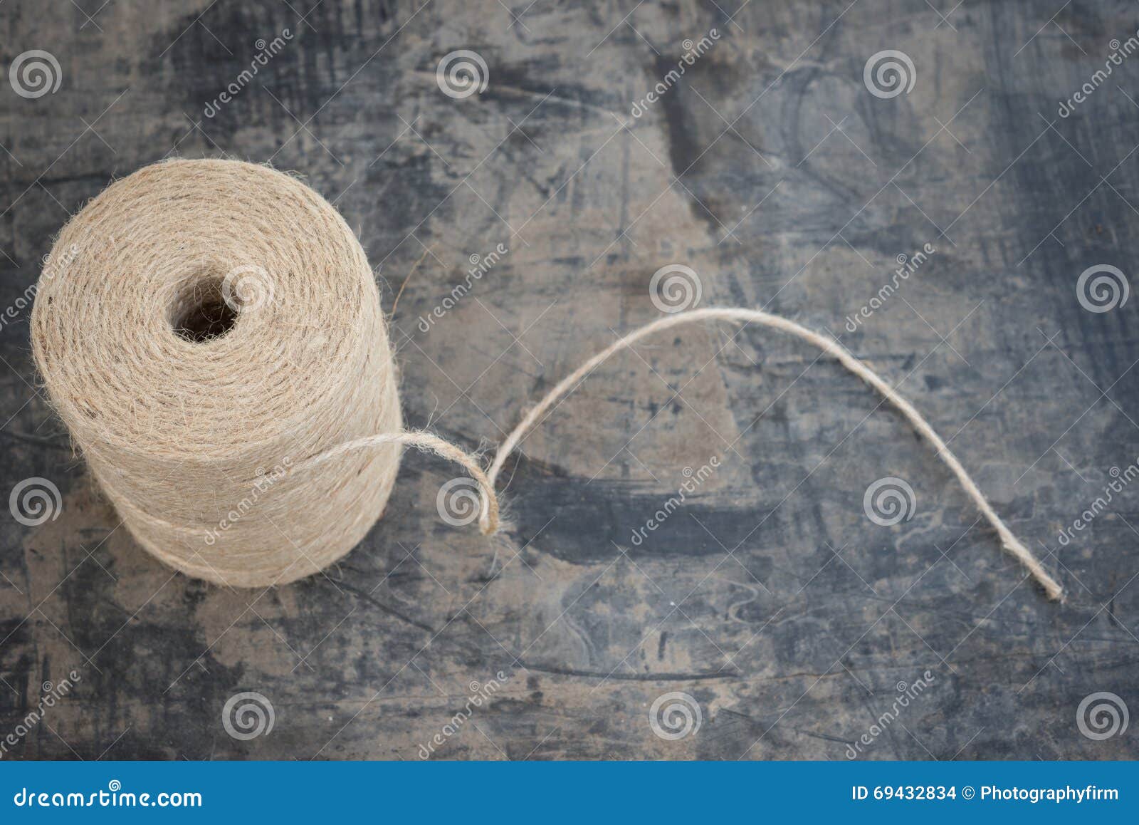 Roll of Light Brown Twine Trailing a Thread Stock Photo - Image of