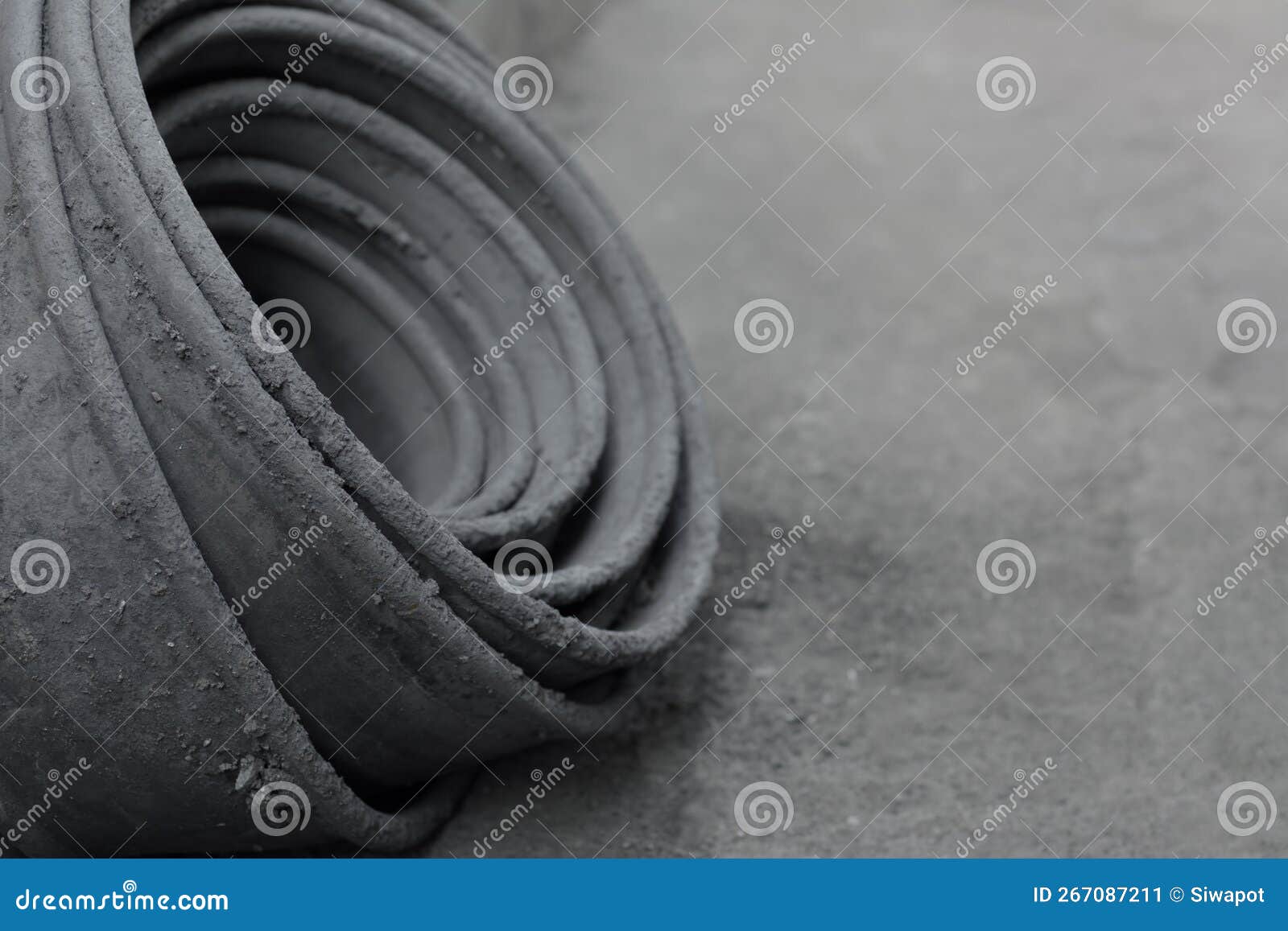Roll of Old Waterproofing Rubber Sheet on Natural Light Stock Image