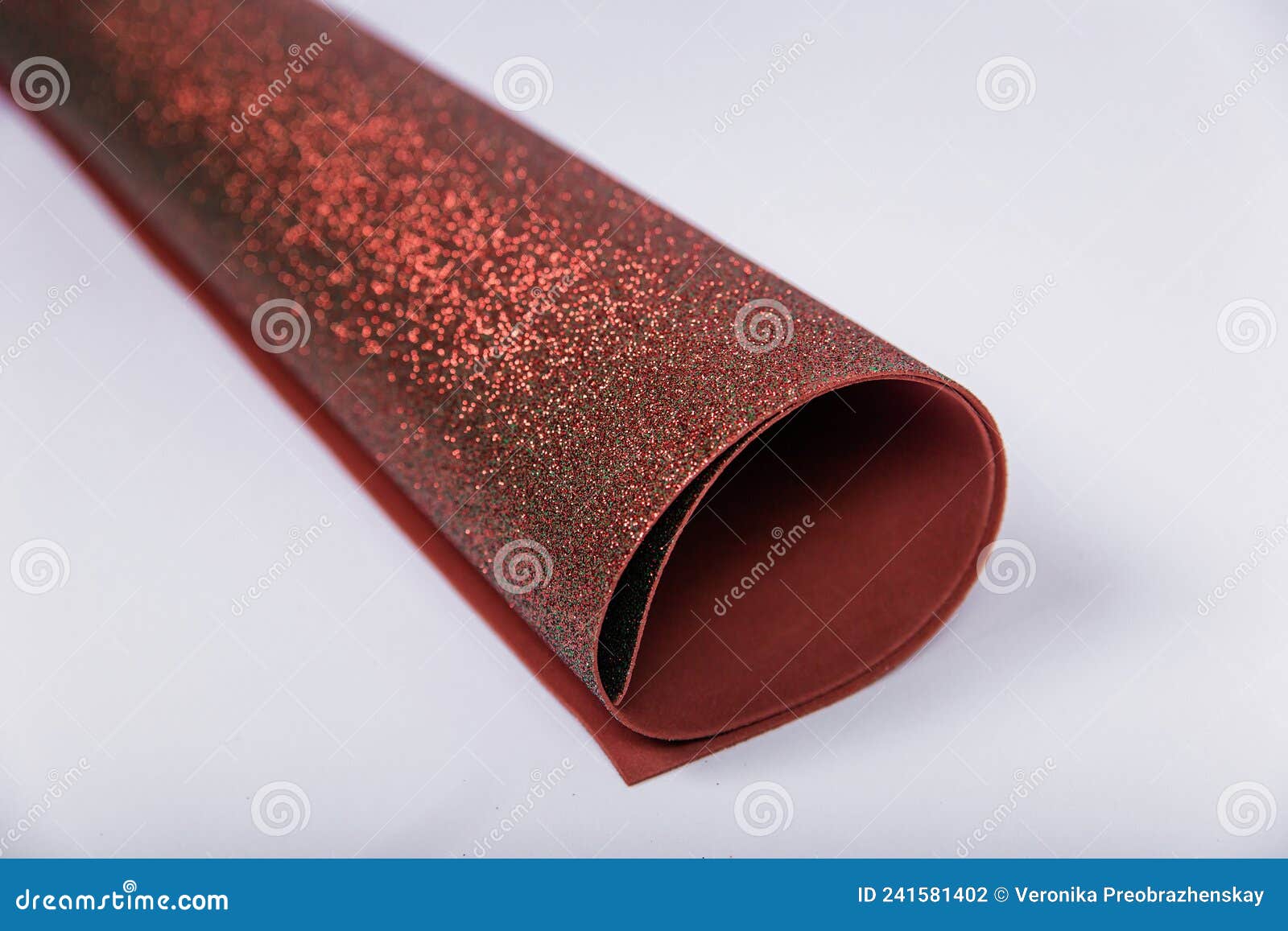 A Roll of Thick Brown Paper with Sparkles on a White Background. Shiny