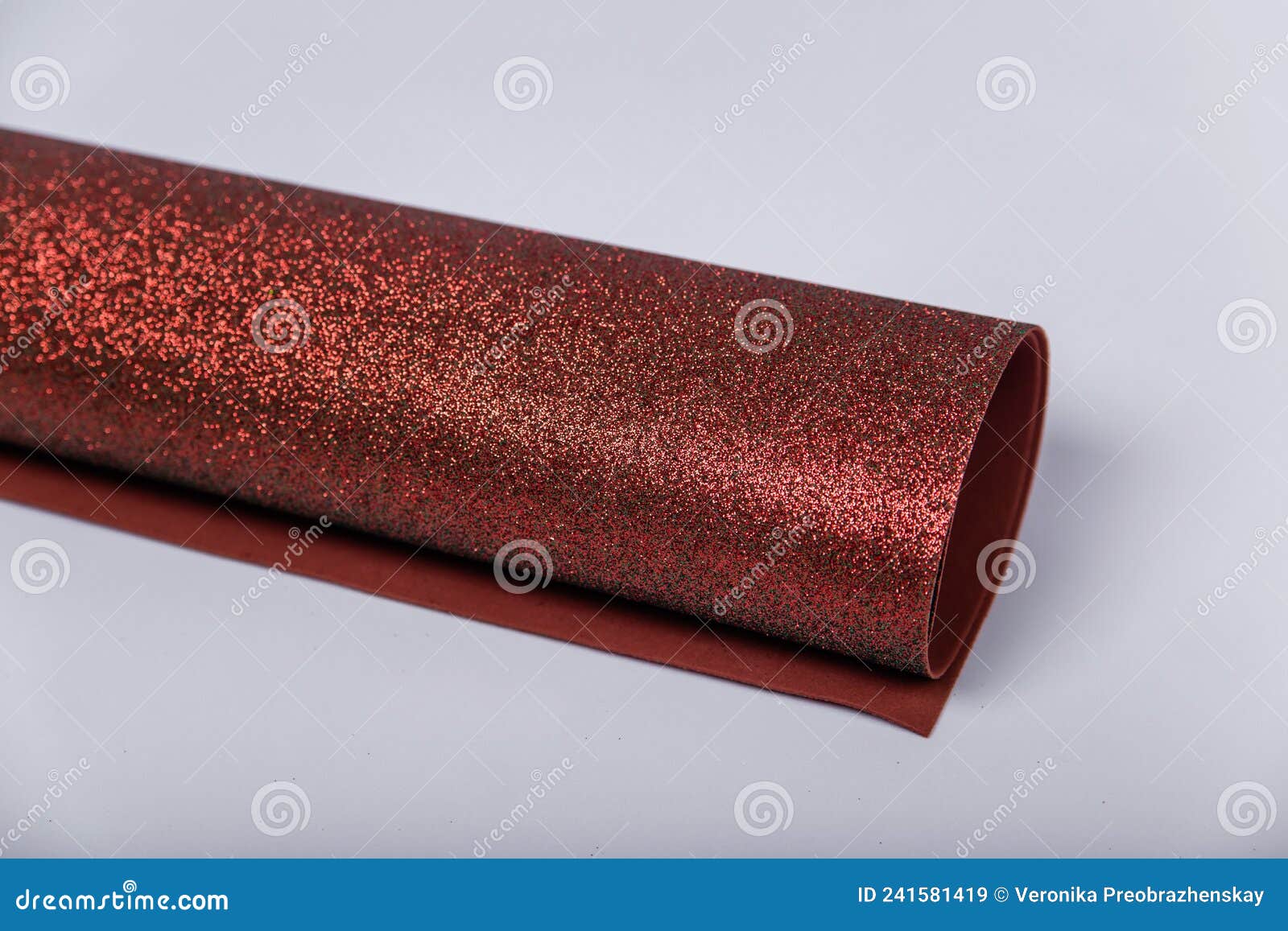 A Roll of Thick Brown Paper with Sparkles on a White Background. Shiny