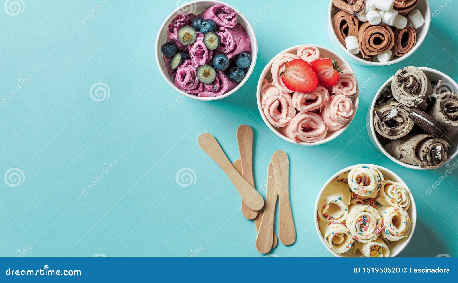 rolled ice creams in cone cups on blue background
