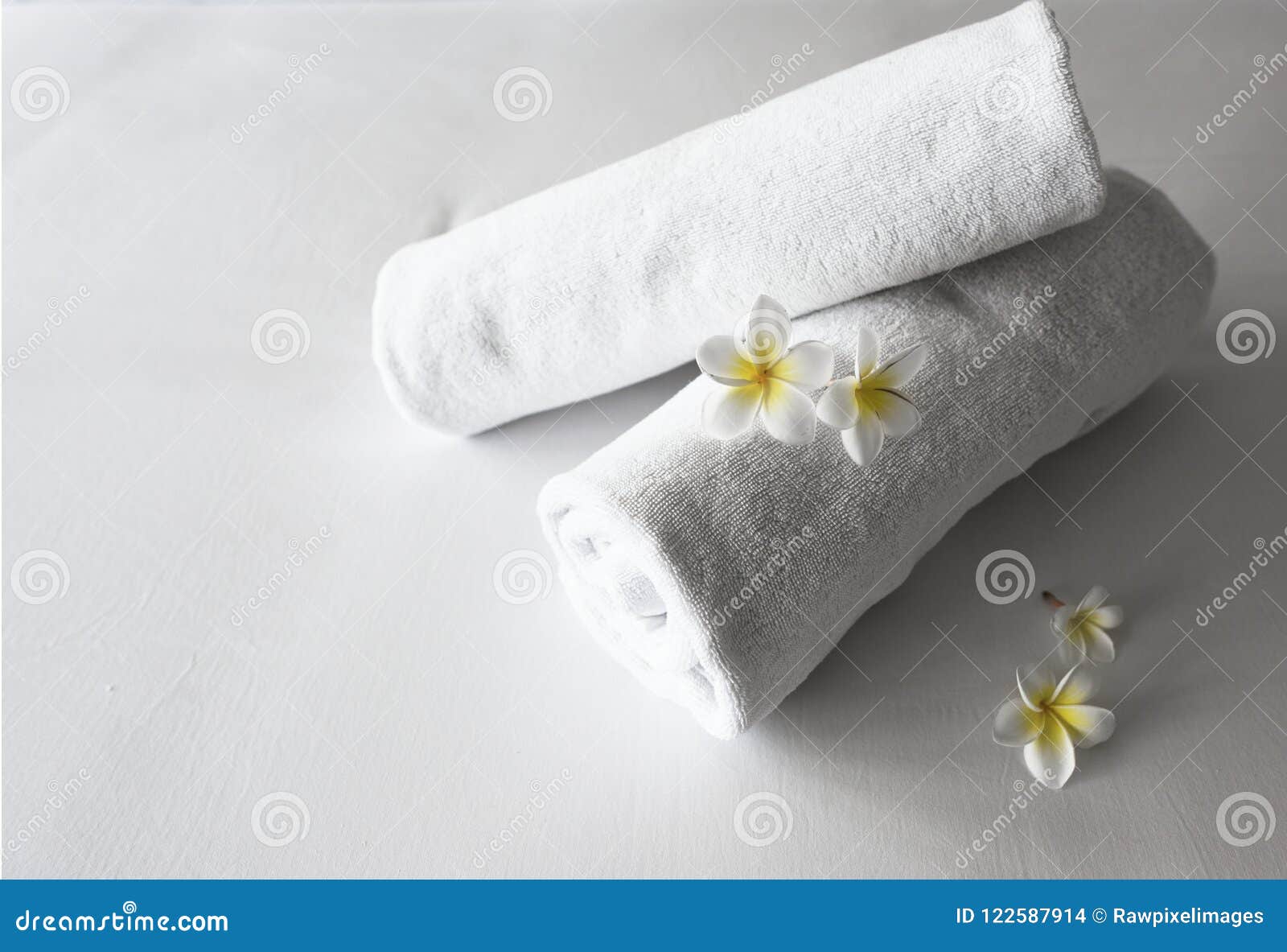 Rolled Up Clean Towels on a Bed Stock Photo Image of flora, fold