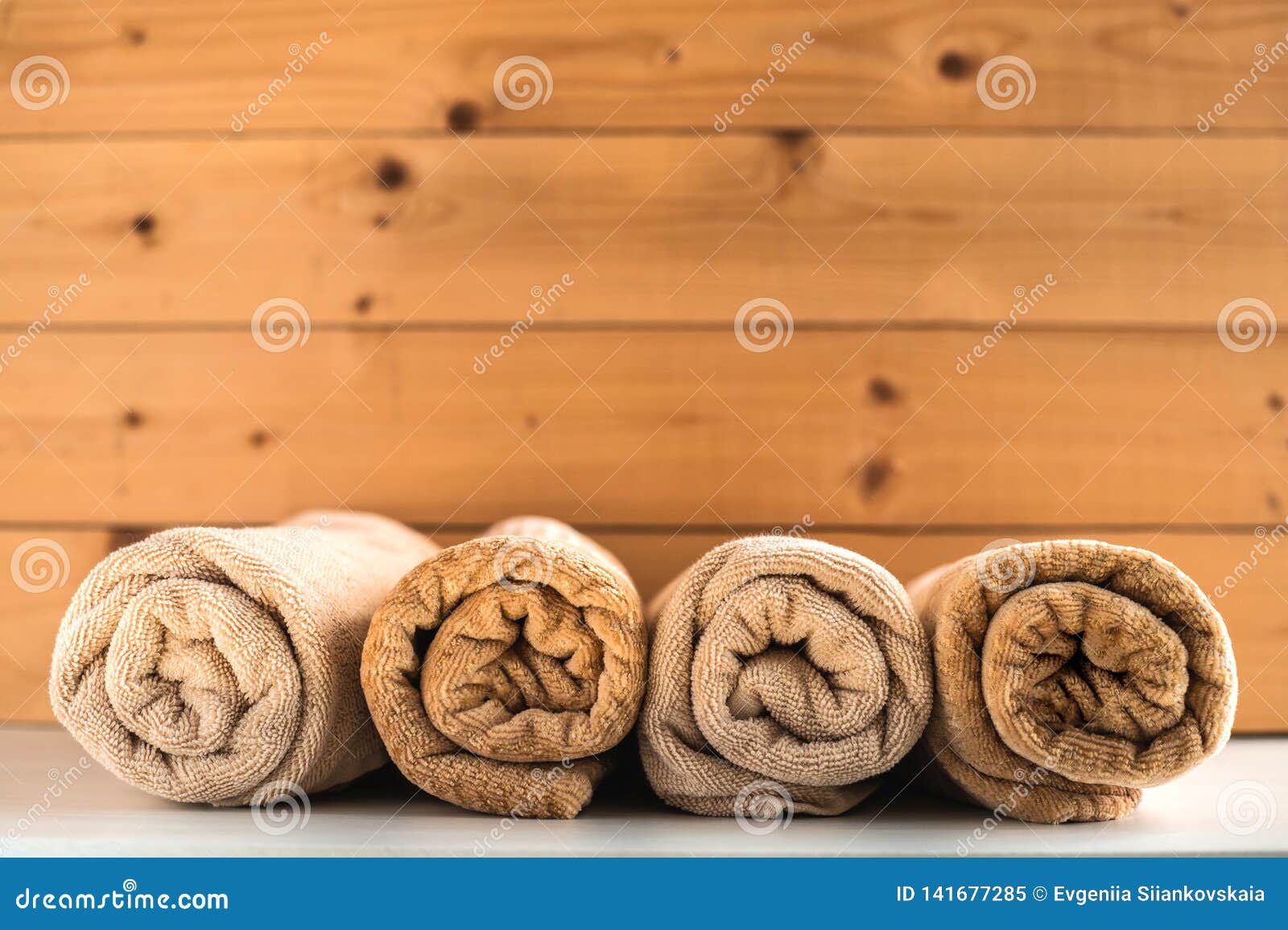 Rolled Up Bath Towels on Wooden Background. Stock Image Image of