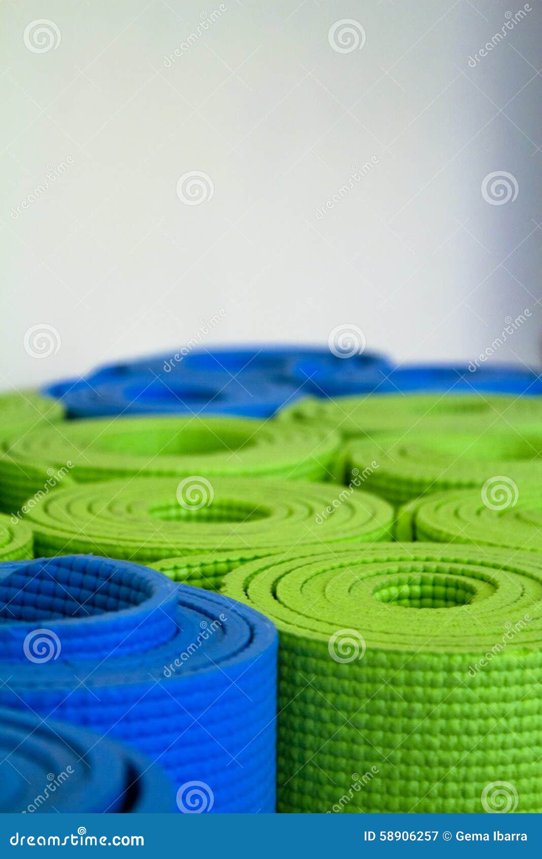 Rolledup yoga mats stock image. Image of space, green 58906257