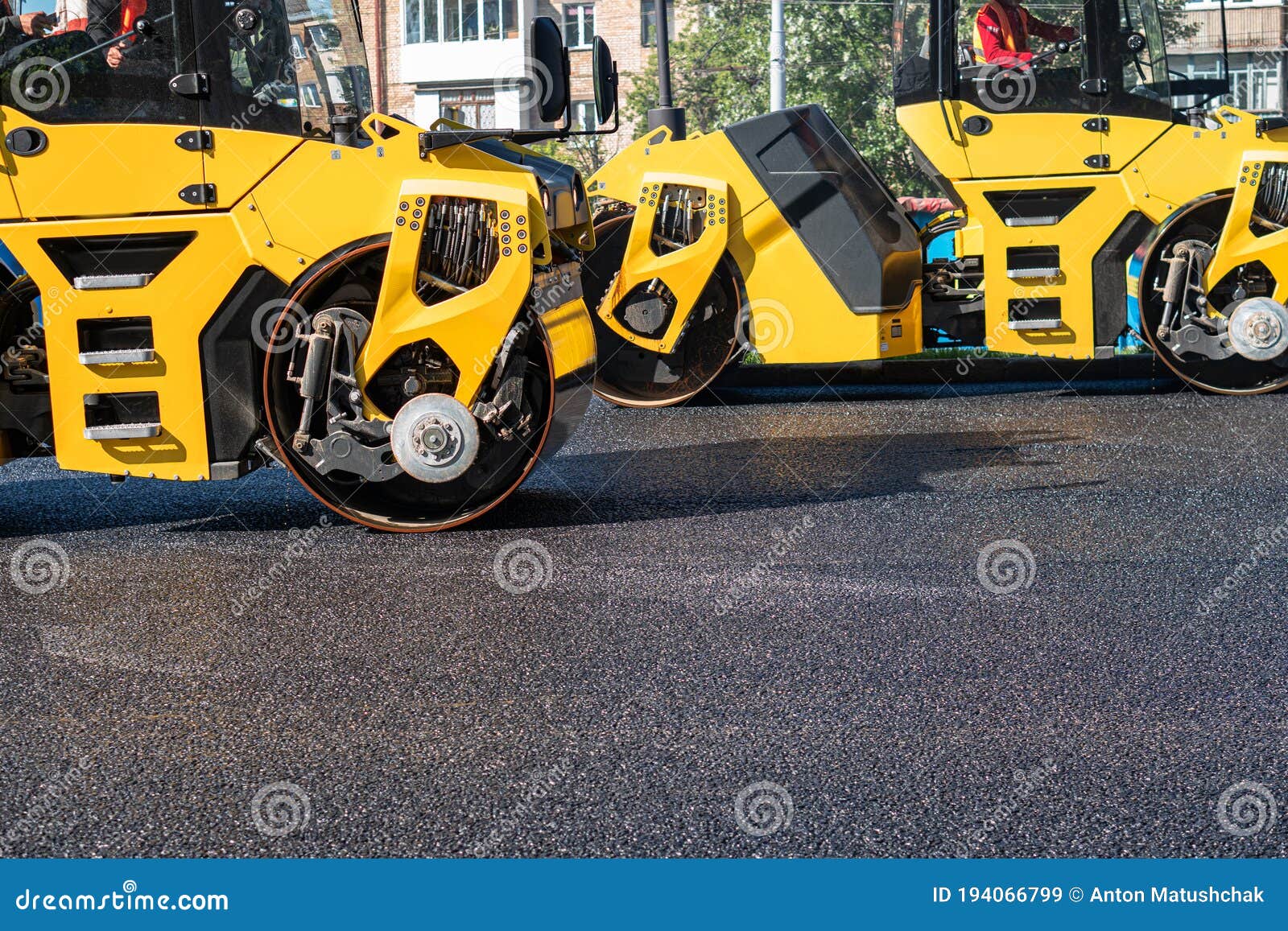The Roller Flattens the Asphalt Tar, Paving the New Asphalt Stock Image