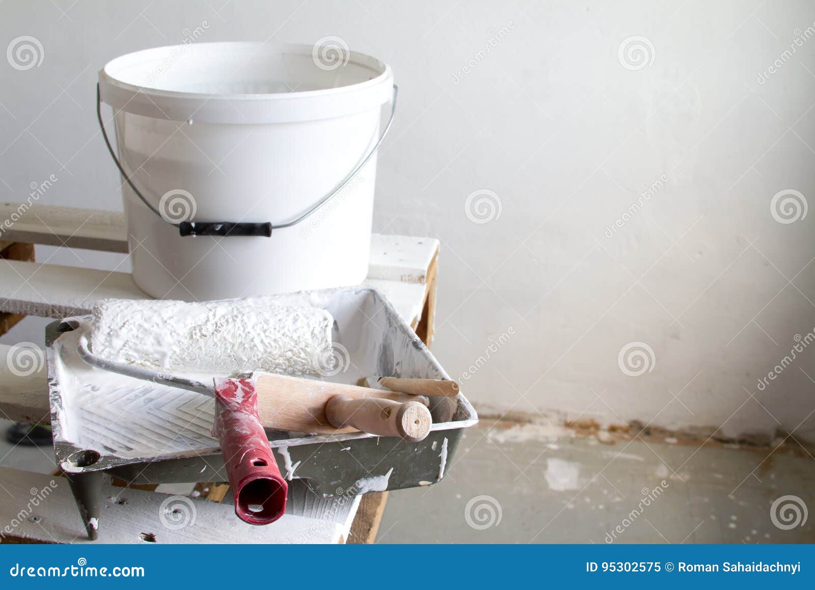 Roller Painting Container and the Painting Roller. Stock Image Image