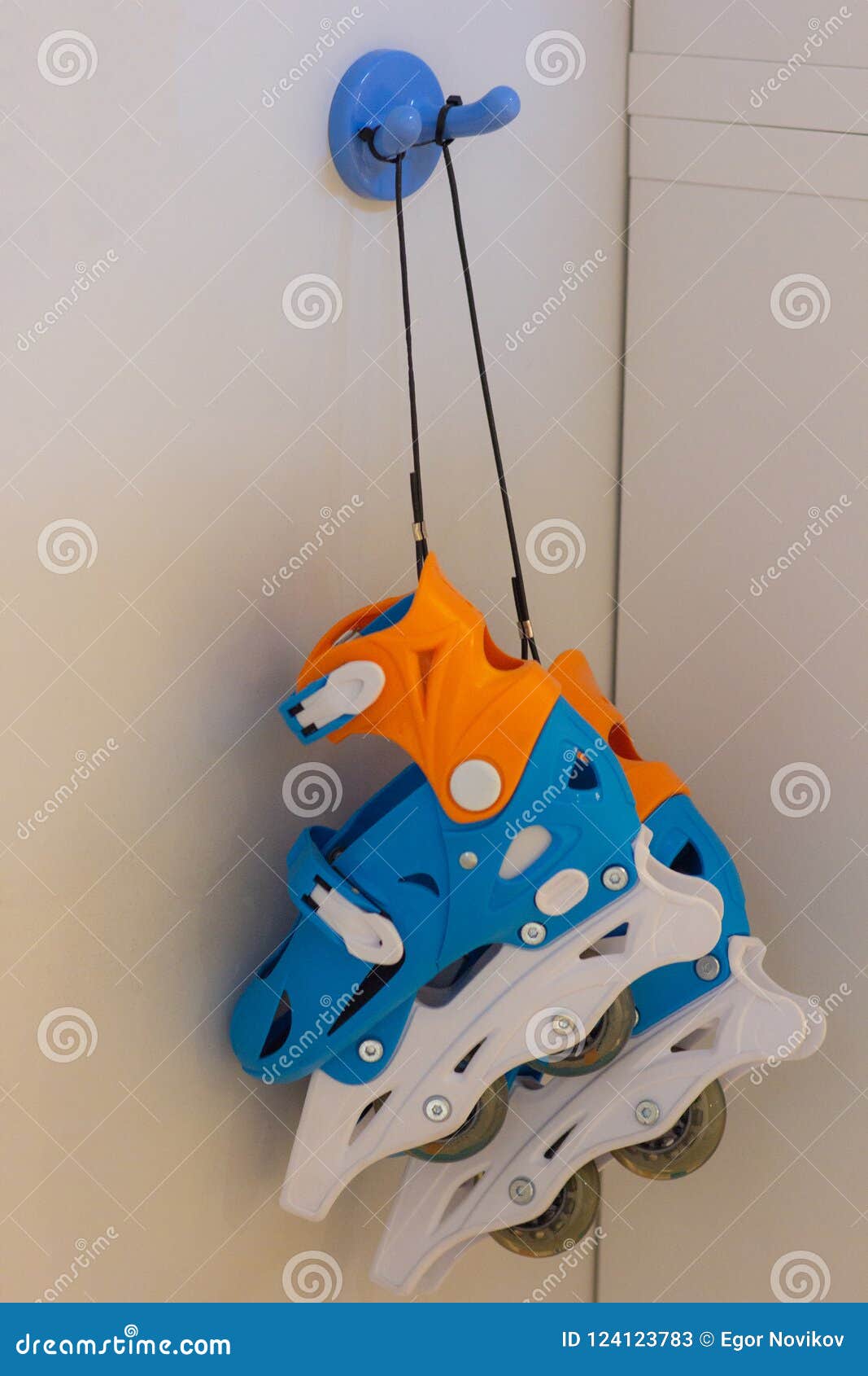 Roller Skates Hanging on a Blue Hook Stock Image Image of road