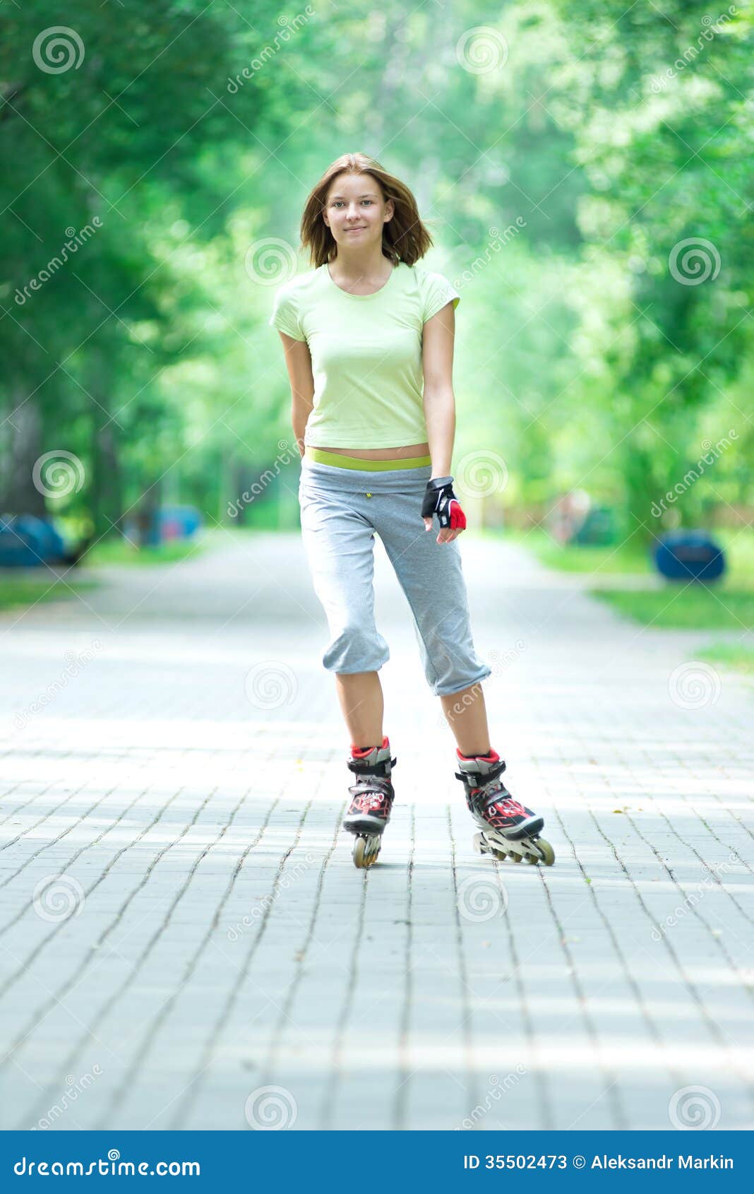 Roller Skating Sporty Girl In Park Rollerblading On Inline Skate Stock