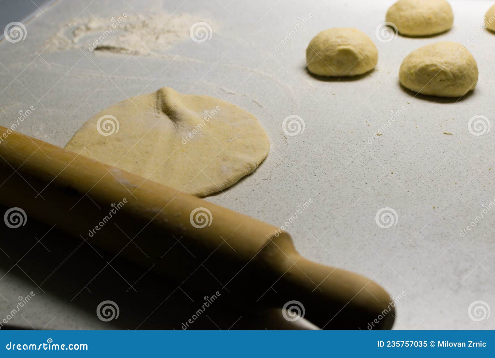 Rolling Pin and Dough on White Kitchen Working Table Stock Image