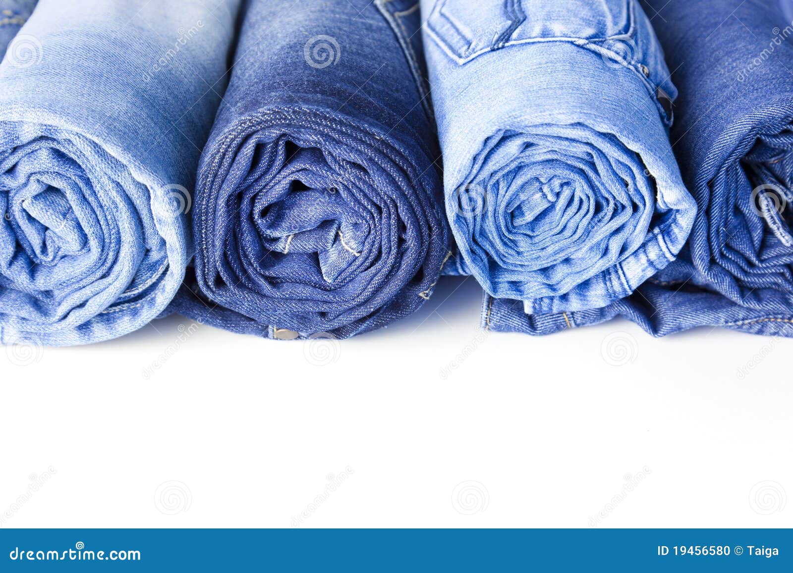 Rolls of Blue Jeans Isolated on White Background Stock Photo - Image of ...